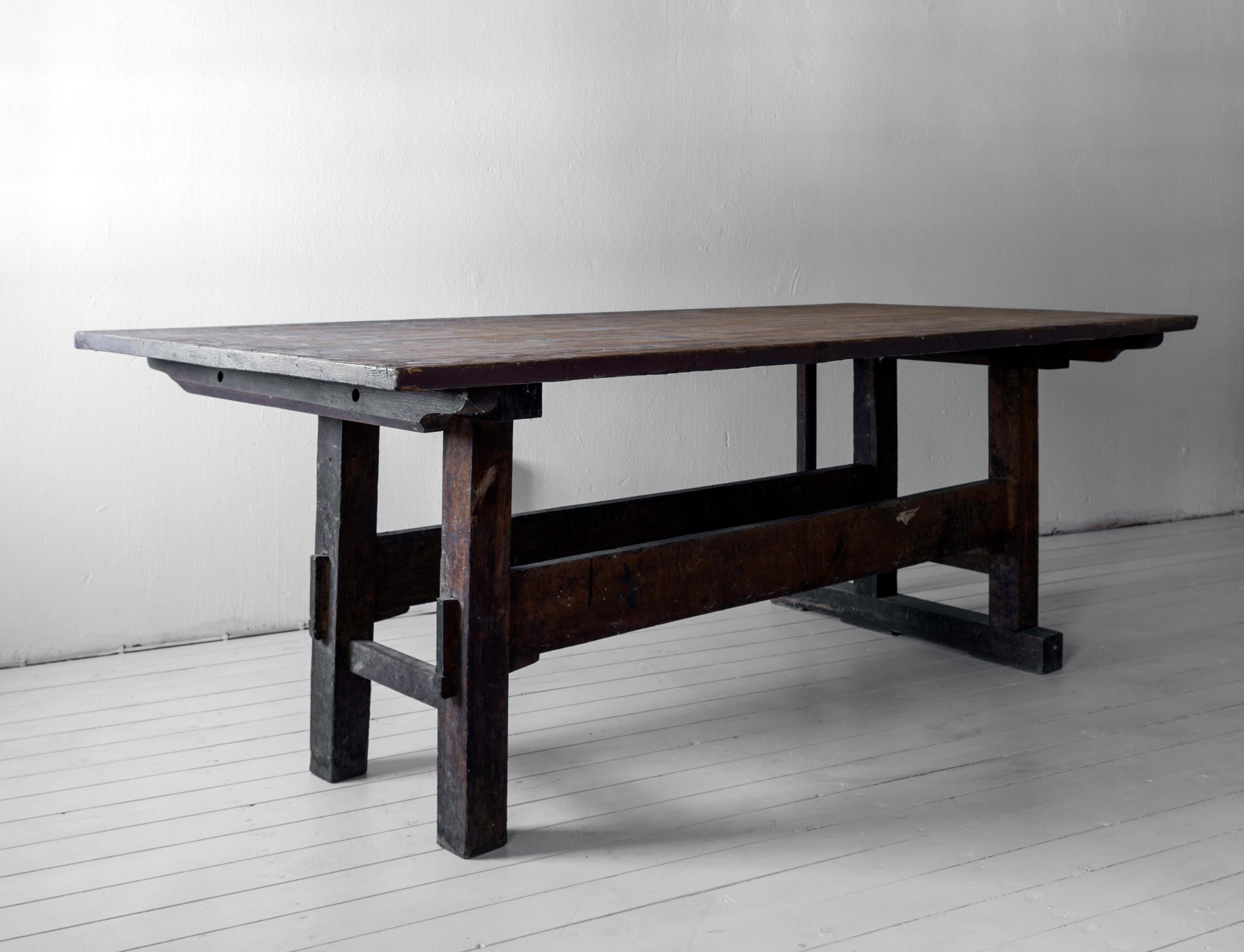 Minimal Wabi Sabi dining table or desk with remains of original paint, formerly possibly a work table. 

The top antique, but not original to the piece.
