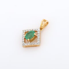 Minimalist 18K Yellow Gold Prong Set Emerald Pendant with Diamonds