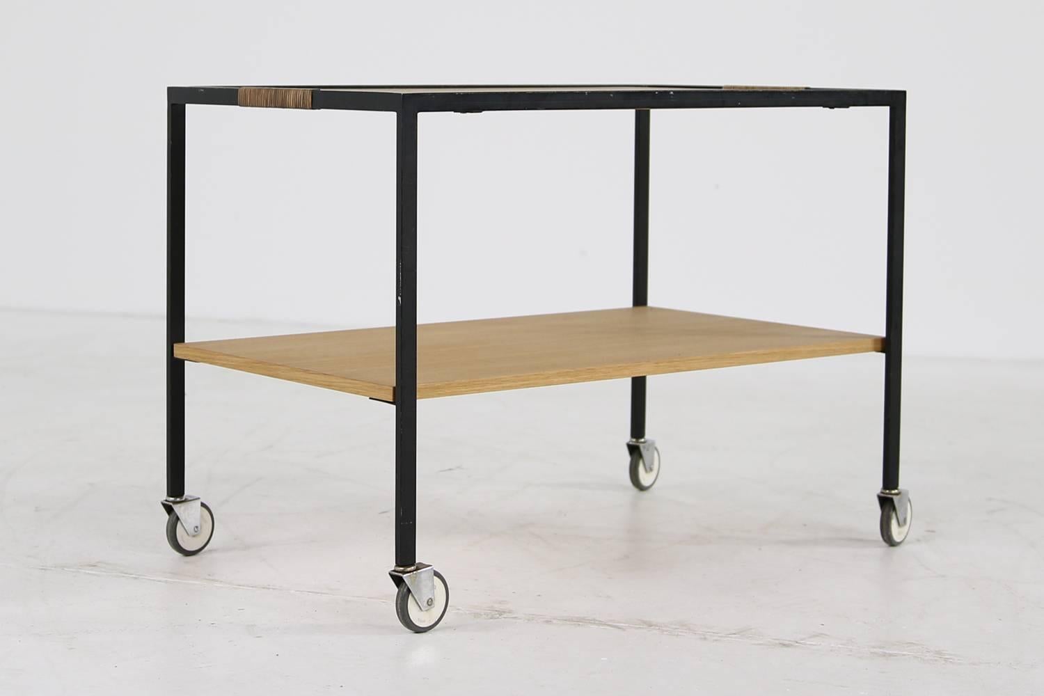 Beautiful Minimalist oak and steel bar cart, design attributed to Herbert Hirche for Holzaepfel or Rosenthal, Germany, 1950s.
Very good condition, the both oak wooden plates were restored and are in a perfect condition.