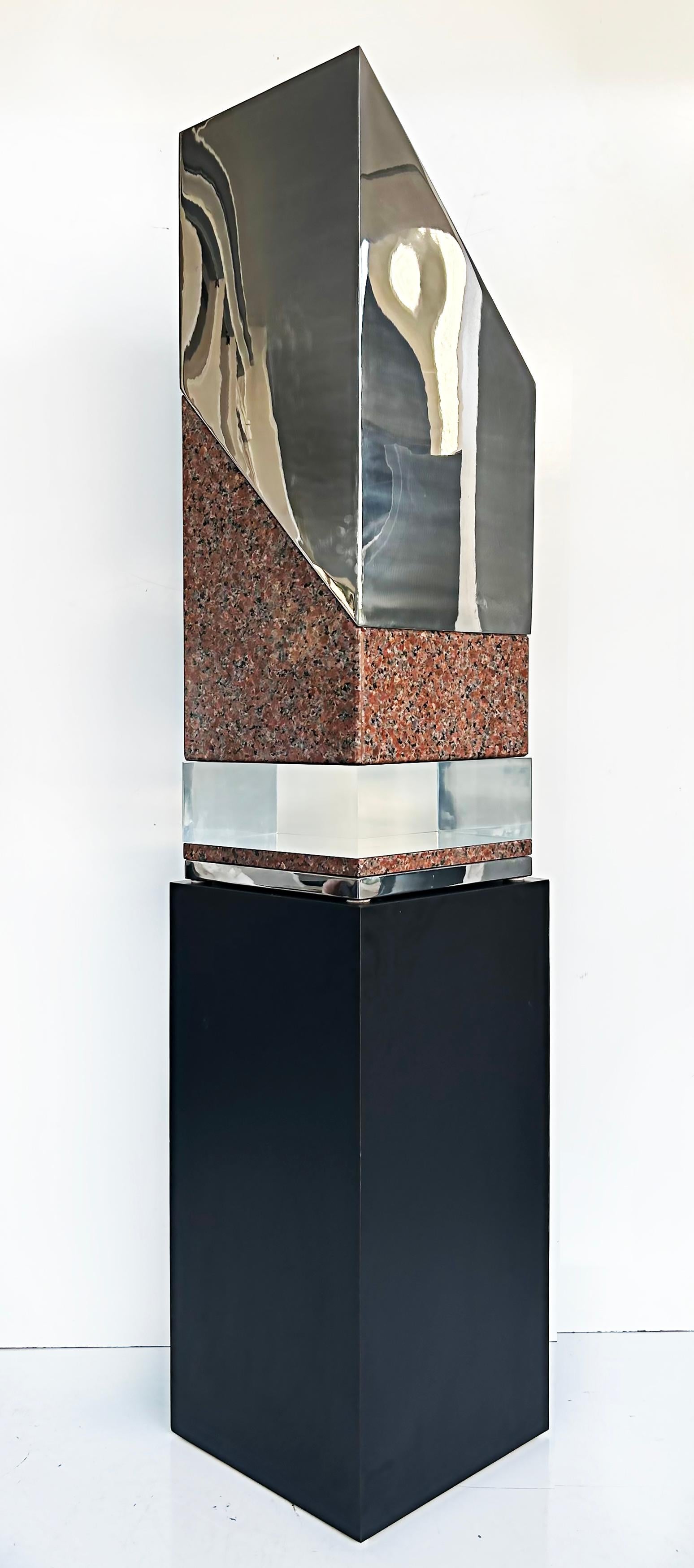 Minimalist Abstract sculpture in stainless steel, granite, Lucite and is Unsigned

Offered for sale is a large minimalist abstract sculpture constructed with stainless steel, granite, and Lucite. The sculpture is mounted on a stainless steel base.