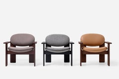 Chaise longue minimaliste Archipen en simili-cuir avec accoudoirs en bois par NOOM