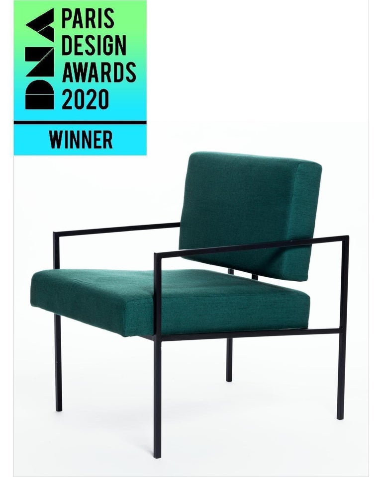 This award winning minimalist armchair 'Helena' designed by Samuel Lamas has an architectonic and geometric reasoning. The aim is to create a simple chair, with pure geometric shapes. Its square crossbars in solid iron create a perfect meeting point