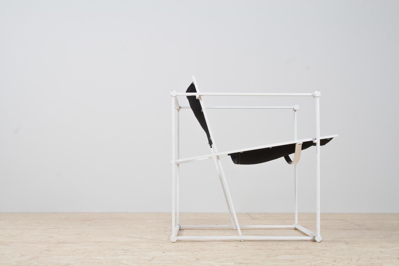 Iconic Bauhaus style and Minimalist armchair in black and white by Radboud Van Beekum for Pastoe, armchair model FM61, in steel and canvas, The Netherlands, 1981. 

This Minimalist design was first presented at the 1980 Triennial in Poznan. After
