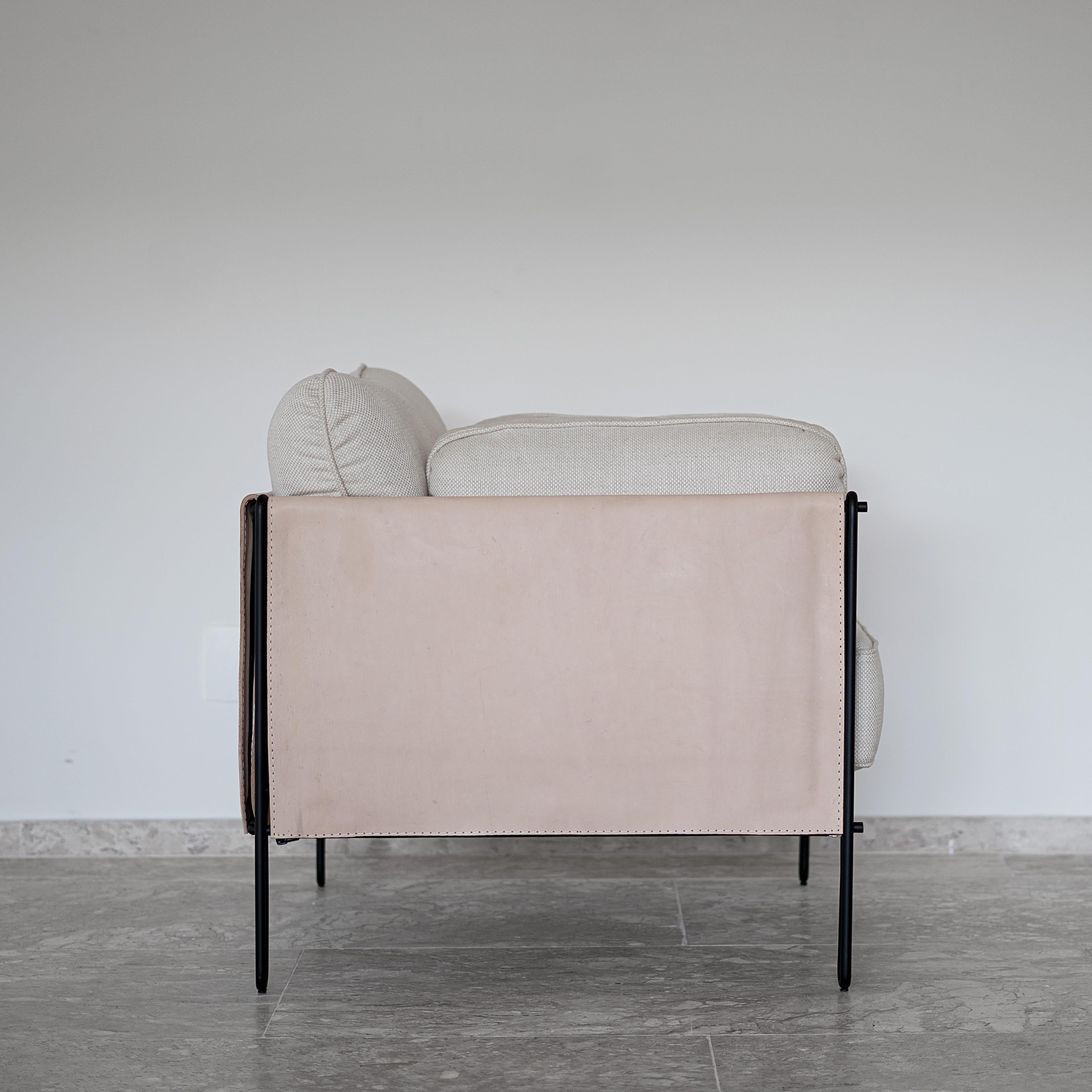 This award winning minimalist armchair in steel and leather is designed within a geometric and architetonic reasoning. Lightness is guaranteed by the delicate iron structure that gently rest the ground. The structure is lined with stout leather and