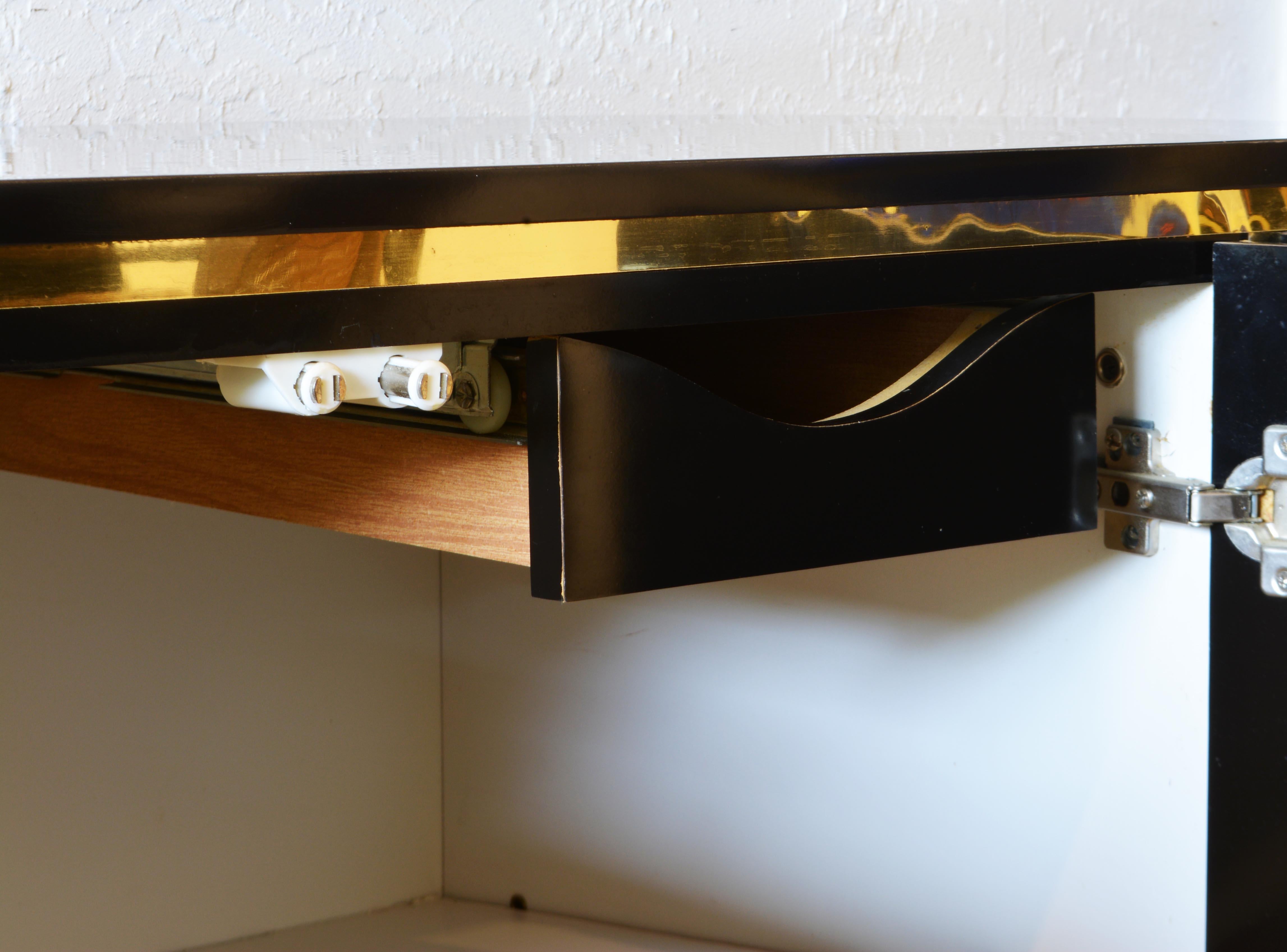 Minimalist Art Deco Style Black Laminate and Brass Oval Small Sideboard Cabinet In Good Condition In Ft. Lauderdale, FL