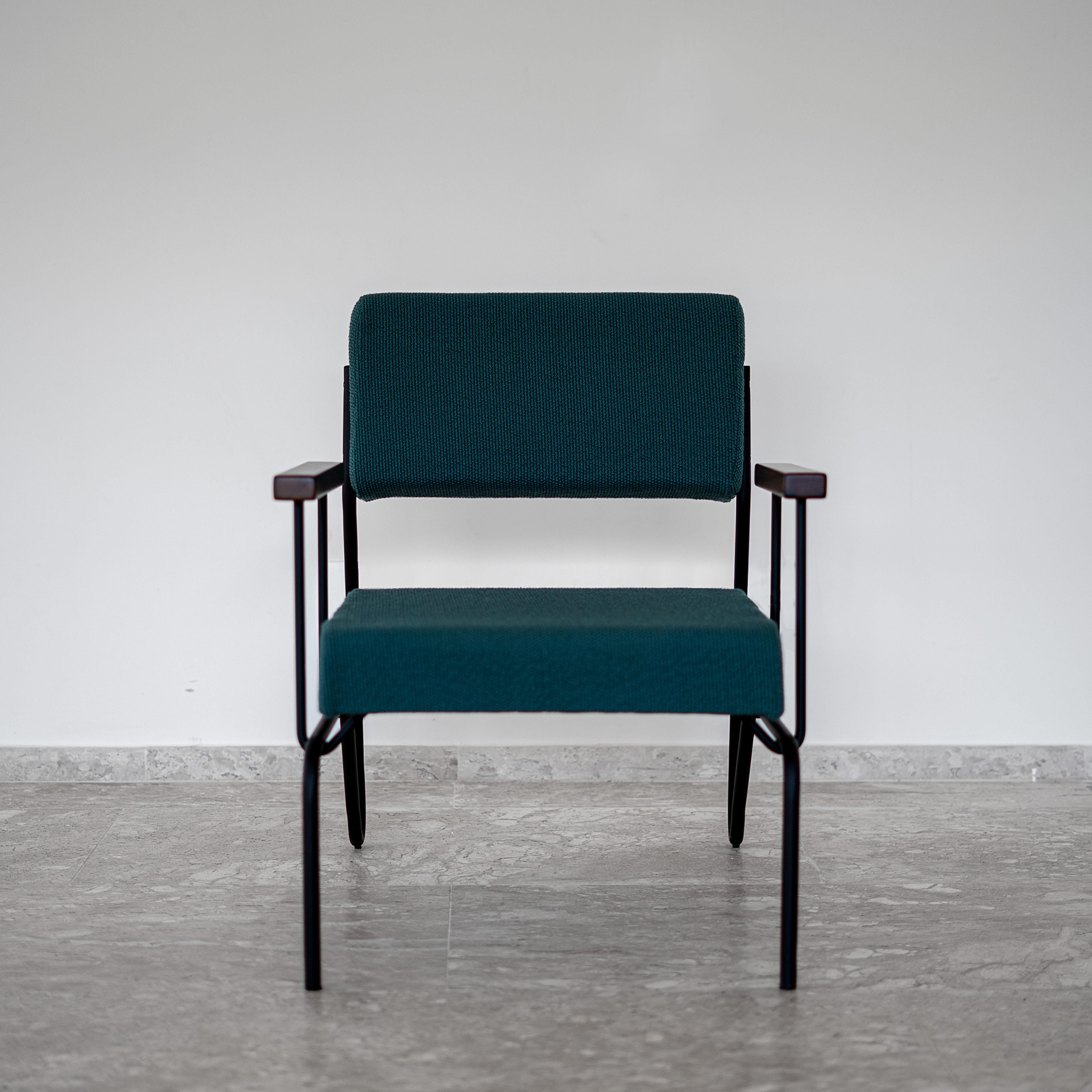 This award winning minimalist armchair in steel, solid wood and leather is designed with a Classic and geometric reasoning. 
The continuity of the structural lines suggests fluidity. The backrest allows a smooth movement and just like the seat, it