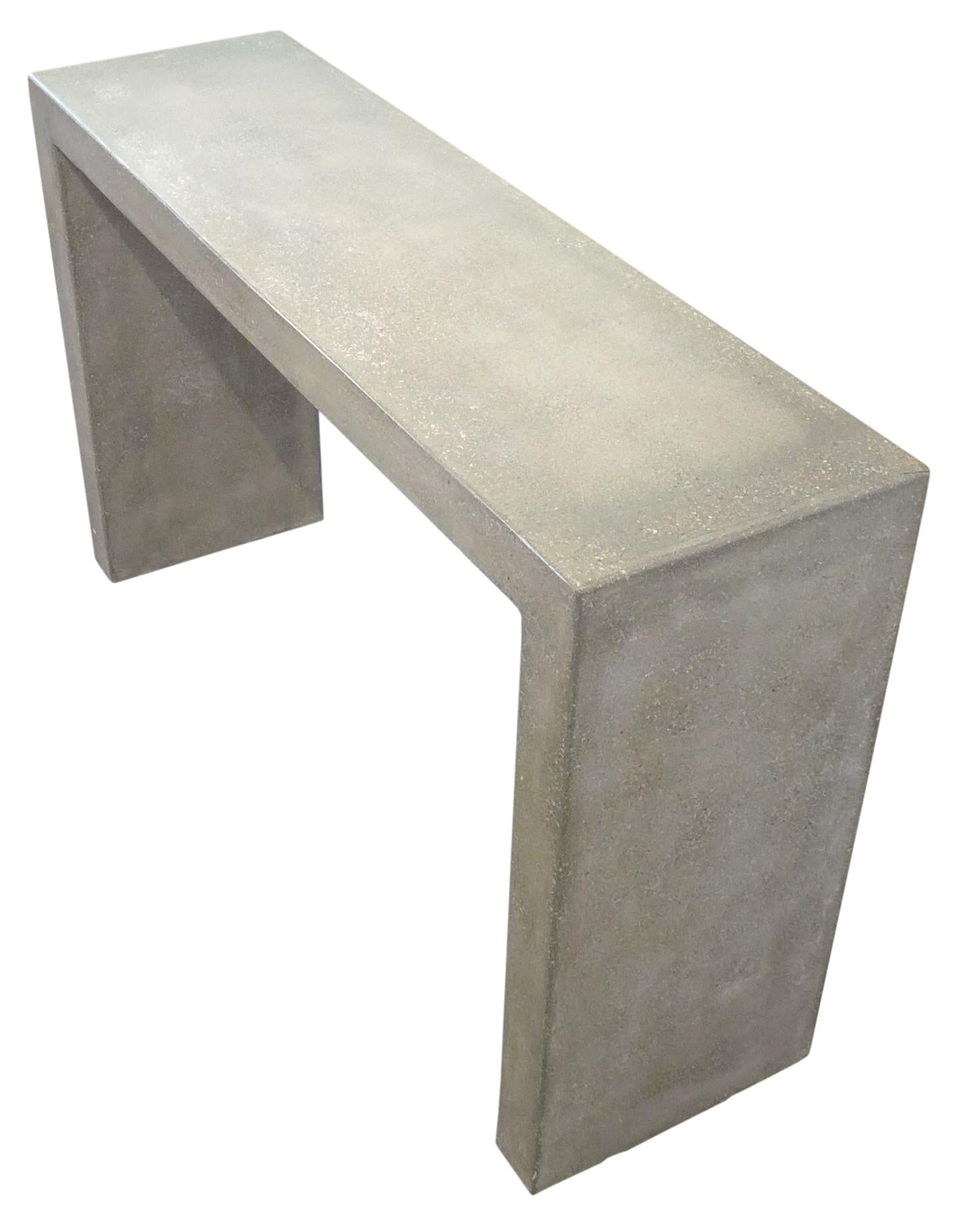 A Minimalist console table of cast concrete. Reduced yet commanding and Judd-like in its simplicity. A very utilitarian form that functions well in a wide range of decorative concepts.
