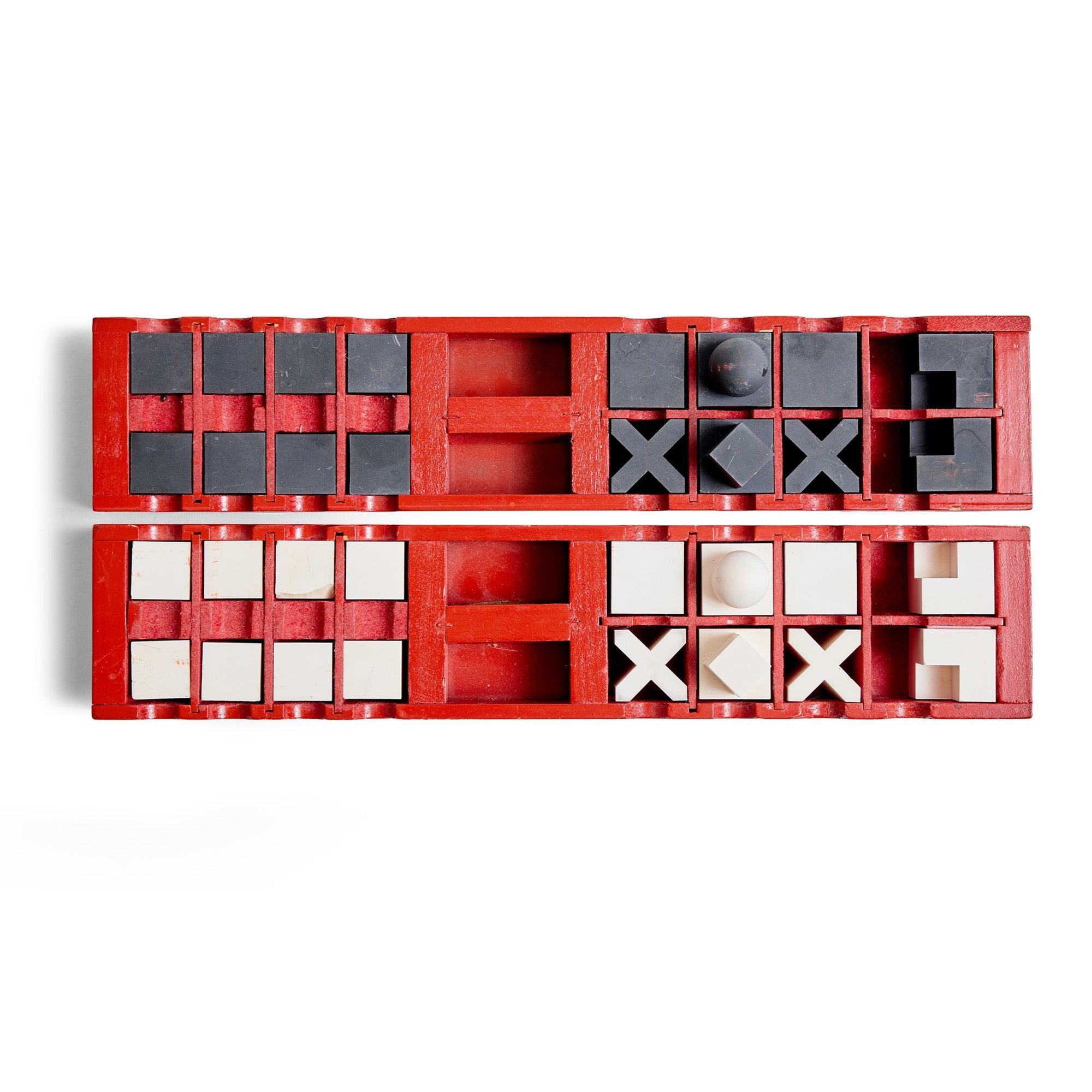 Bauhaus designed ceramic and aluminum chess set housed in individual wood red cases.