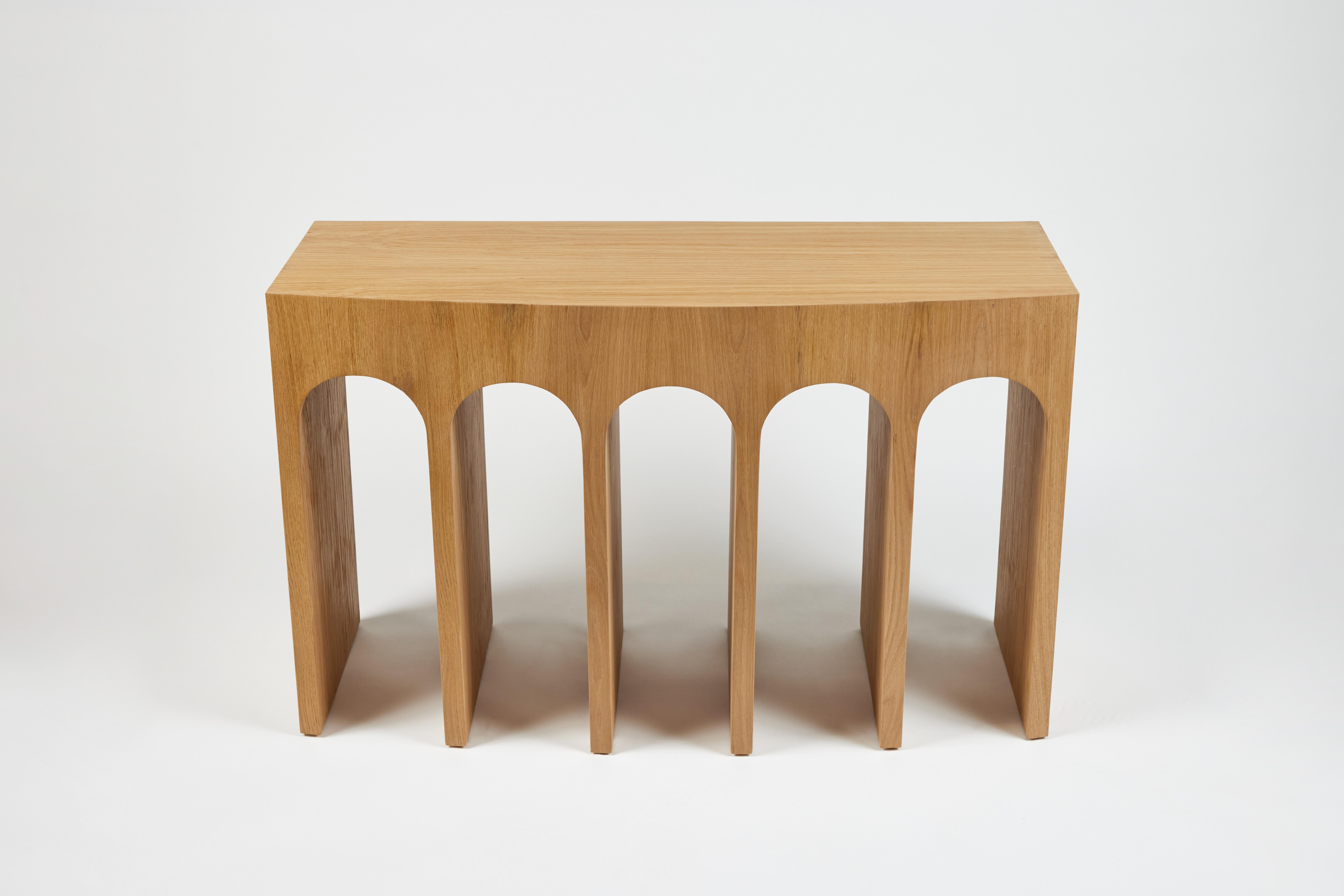 Martin & Brockett's Arcade Console 48” is a nod to the ancient Roman architectural form- a succession of contiguous arches supported by columns. It features a slight convex curvature at the face and a textured surface.

Standard: H 30 in. x W 48 in.