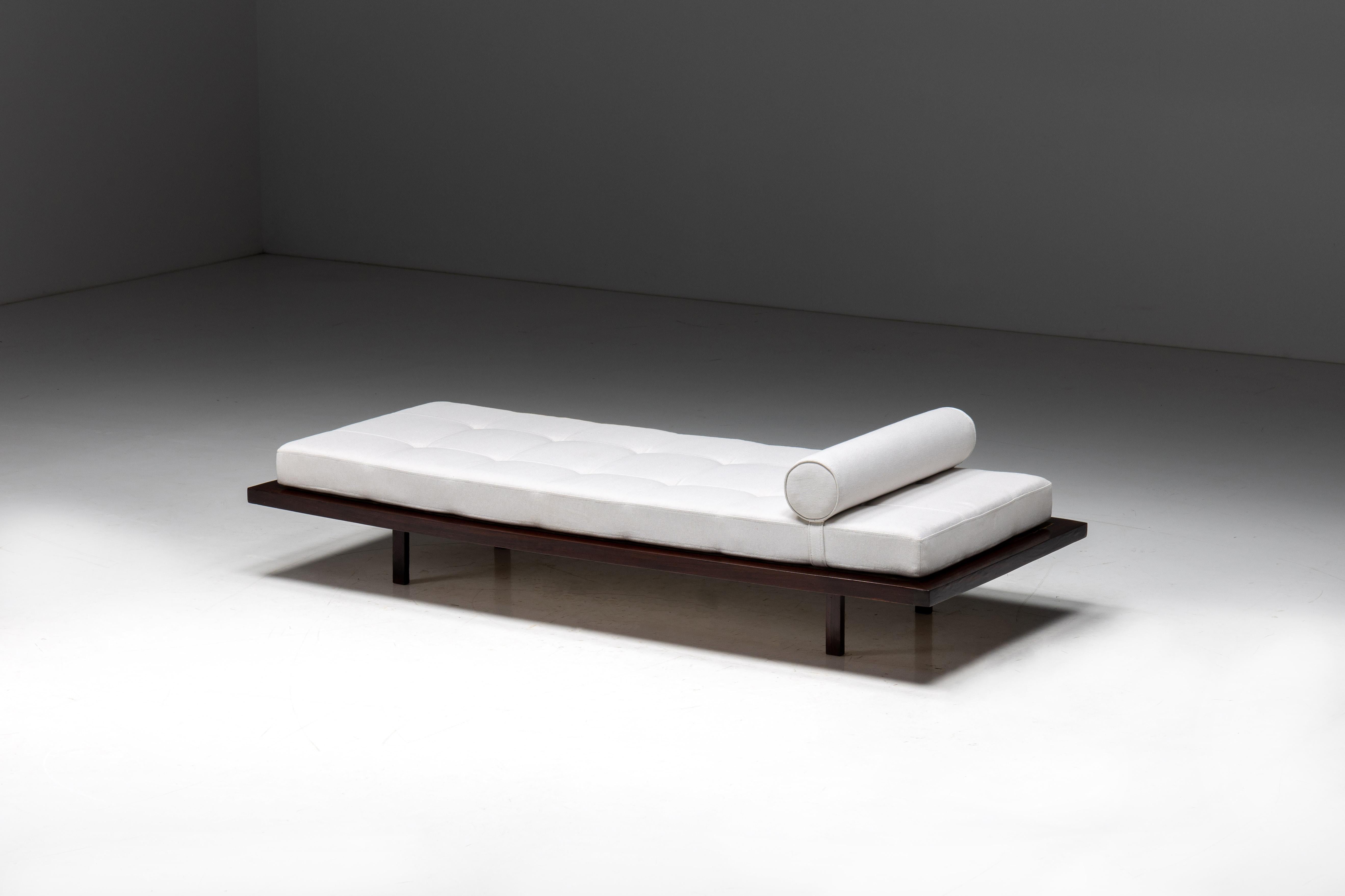 This exceptional daybed from the 1960s, designed by renowned Polish-Brazilian architect and designer Jorge Zalszupin, is a testament to mid-century modern elegance. Crafted with a minimalist approach, it boasts a warm wooden frame with an inviting