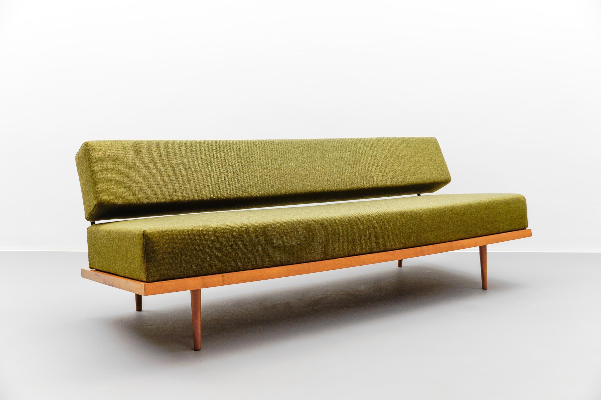 The sofa can be transformed into a day bed with a lying surface of 192 cm x 110 cm by simply pushing the backrest backwards.

Beautiful minimalist daybed, designed by Josef Pentenrieder in 1954 and published by Hans Kaufeld. Germany, around