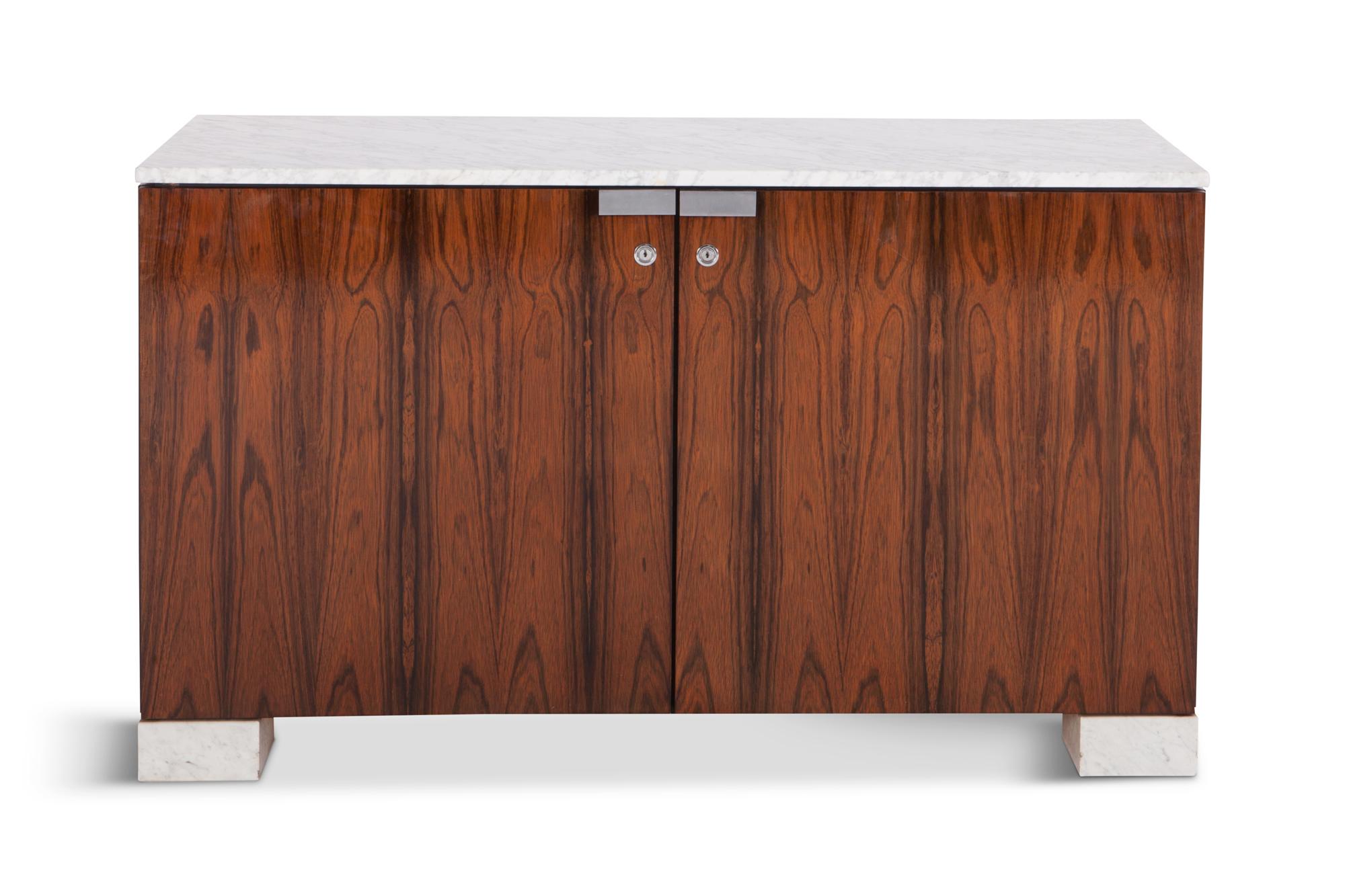 Mid-century modern Sideboard in very rich materials such as rosewood and Carrara marble top by De Coene Freres — Belgium 1960s. 

This high quality cabinet is provided with two doors that are finished with locks and chrome handles that contrast very