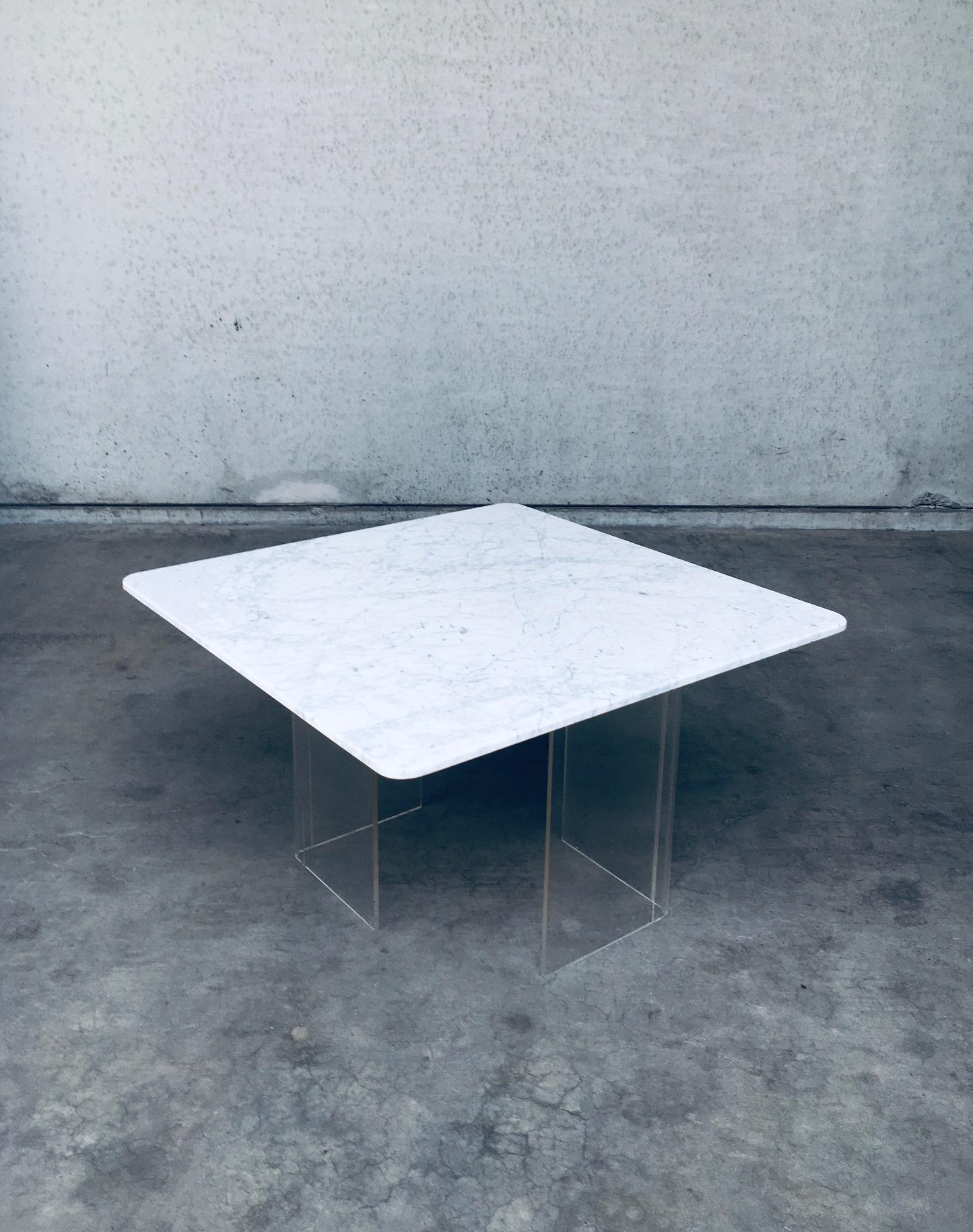 Vintage Minimalist Italian Design Carrara Marble Floating Square Dining Table. Made in Italy, 1970's period. No maker markings or labels found. This square thin Carrara Marble top floats on 2 perspex / plexi glass L shaped feet. You can place these
