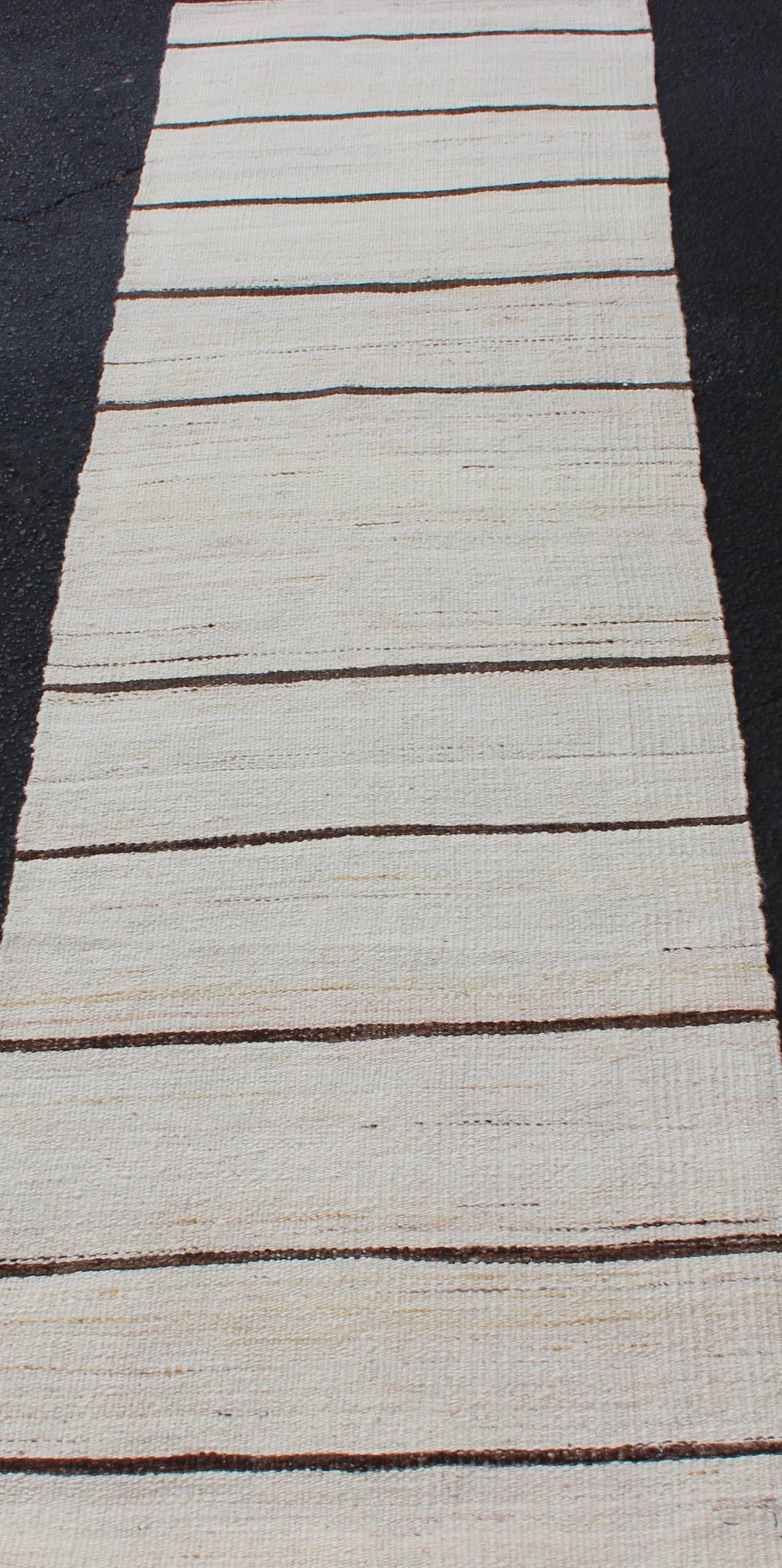 Minimalist Design Vintage Kilim Runner with Stripes in Brown and Ivory. Keivan Woven Arts / Rug EN-2171, country of origin / type: Turkey / Kilim, circa 1950
Measures: 2'2 x 7'10 
This vintage flat-woven kilim runner features a minimalist design