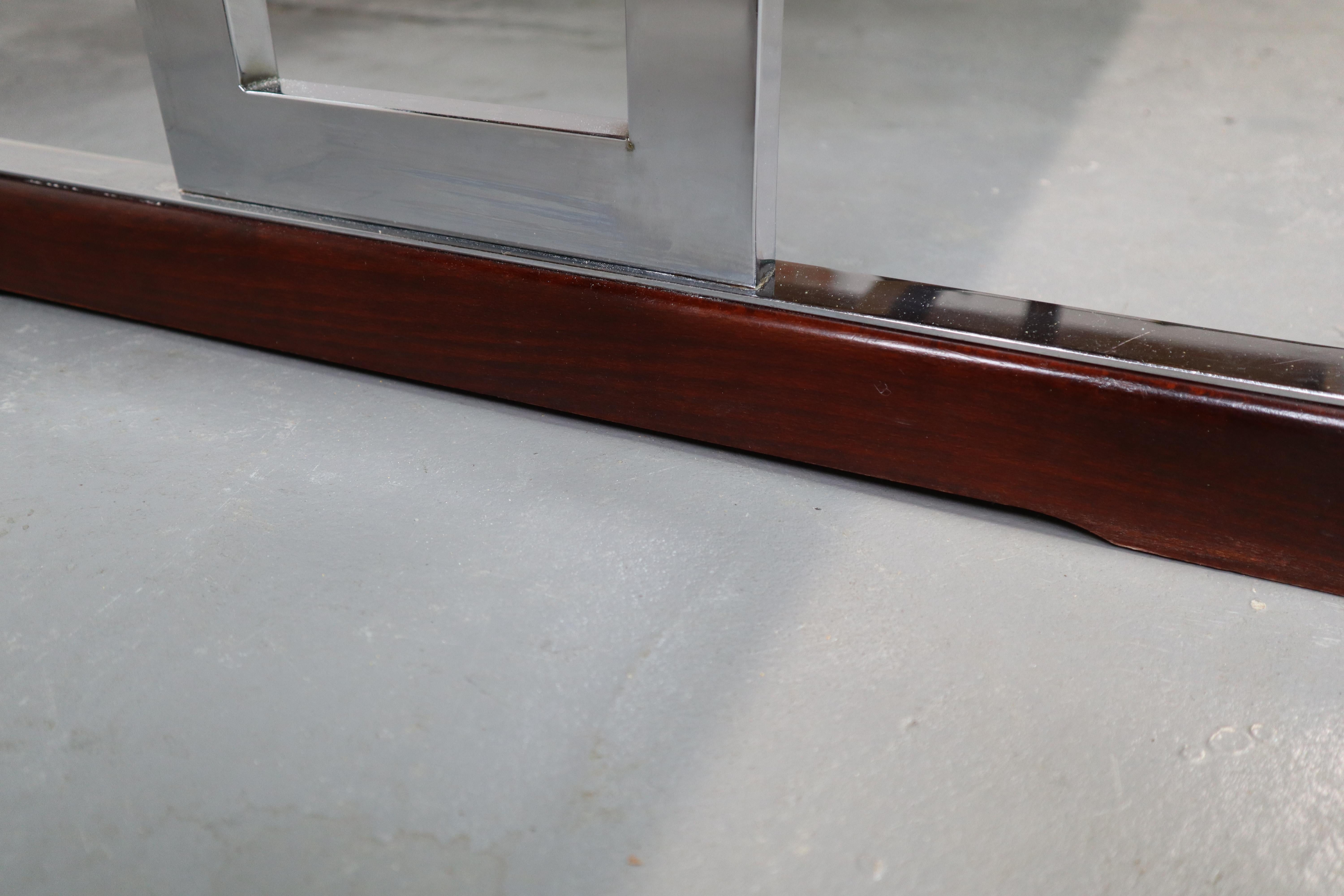 Minimalist extendable dining table in Indian Rosewood and chrome produced by 'Meubelfabriek Aurora' Belgium, 1967.
Sideboard and bar cabinet also available.
With original invoice and catalogue!

Dxhxl: 89x74x169 cm
With extensions up to 269
