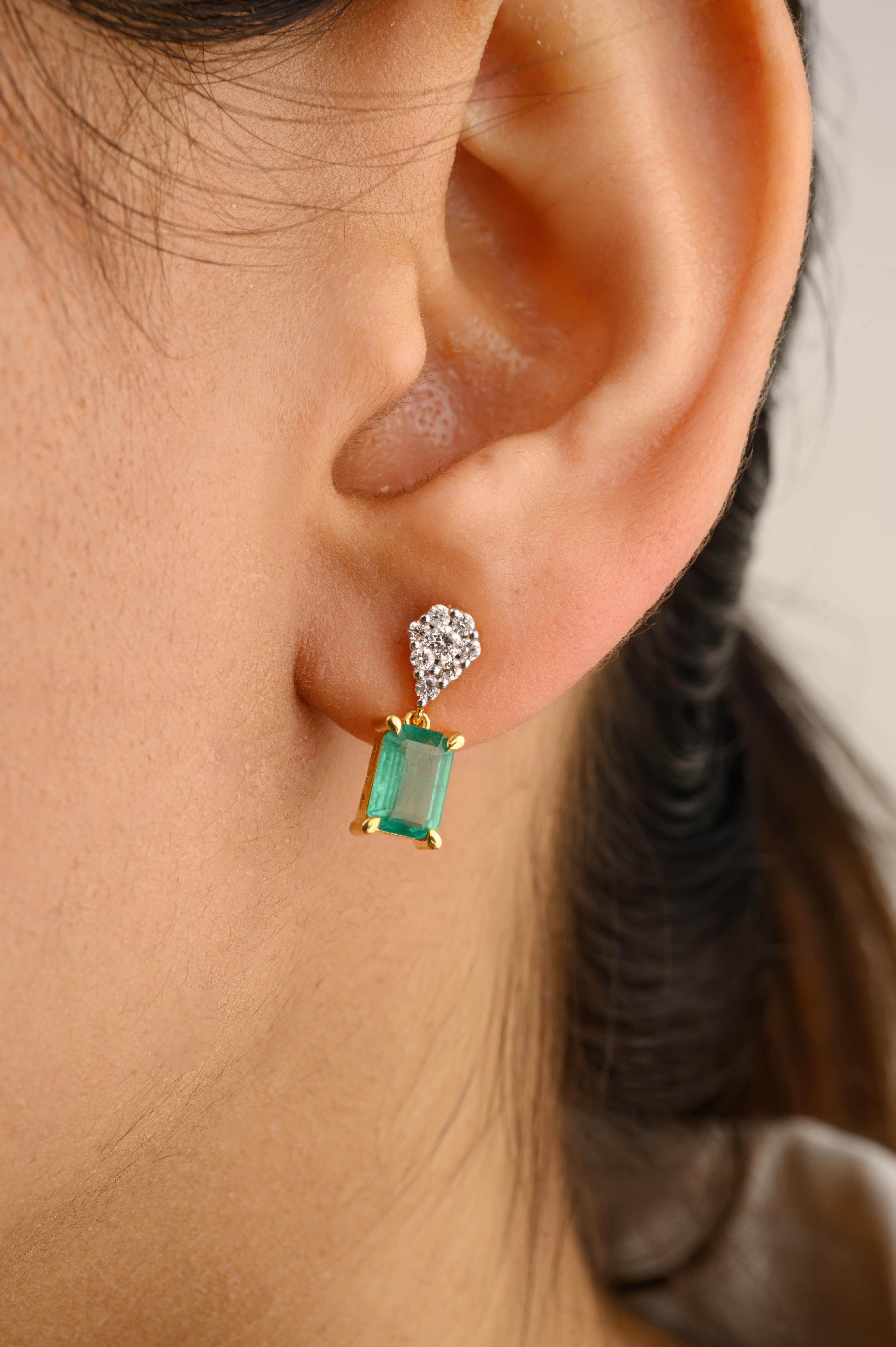 Minimalist Emerald Dangle Earrings with Diamond in 14K Gold to make a statement with your look. You shall need dangle earrings to make a statement with your look. These earrings create a sparkling, luxurious look featuring octagon cut emerald and