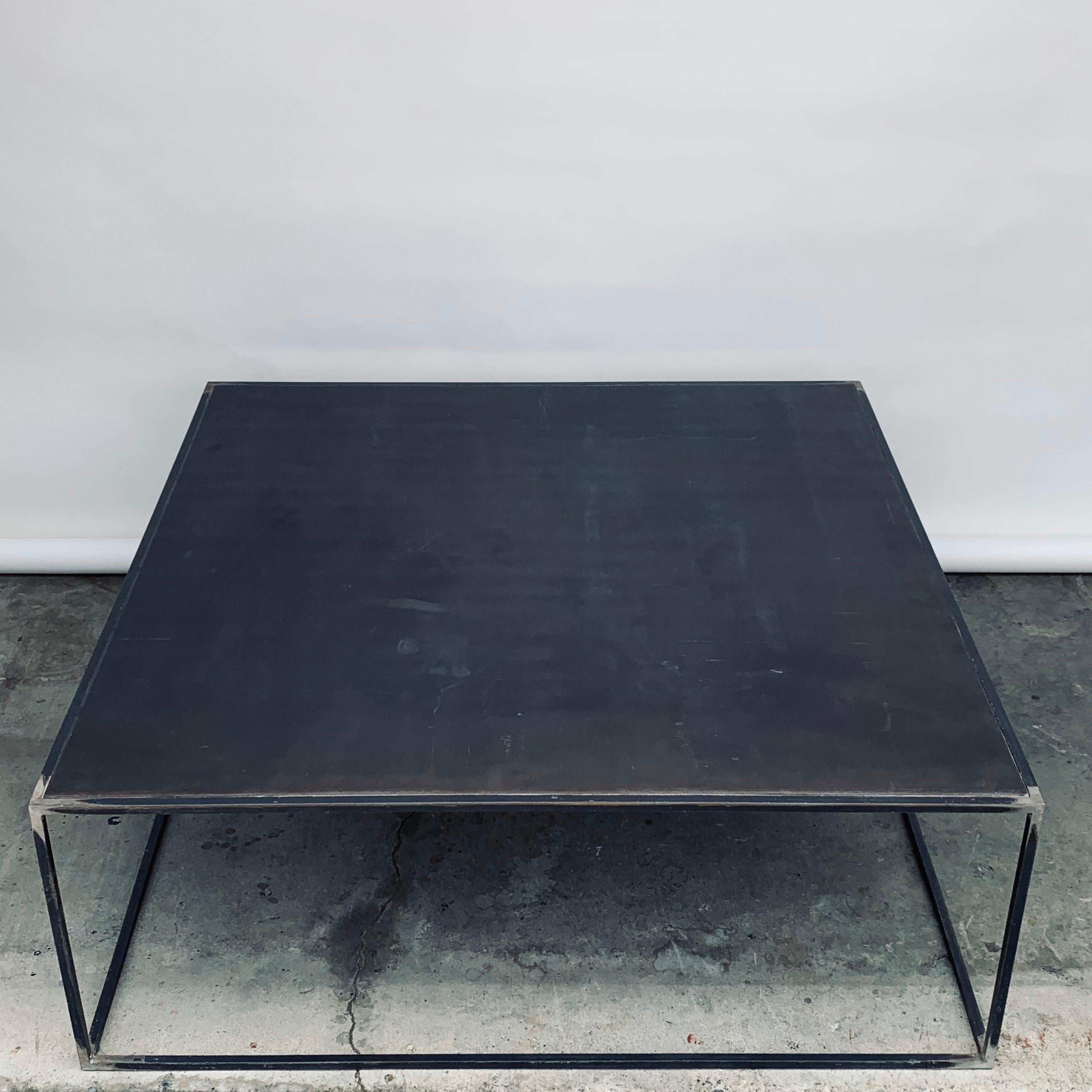 Minimalist 'Filiforme' patinated steel square coffee tables by Design Frères. Sealed.