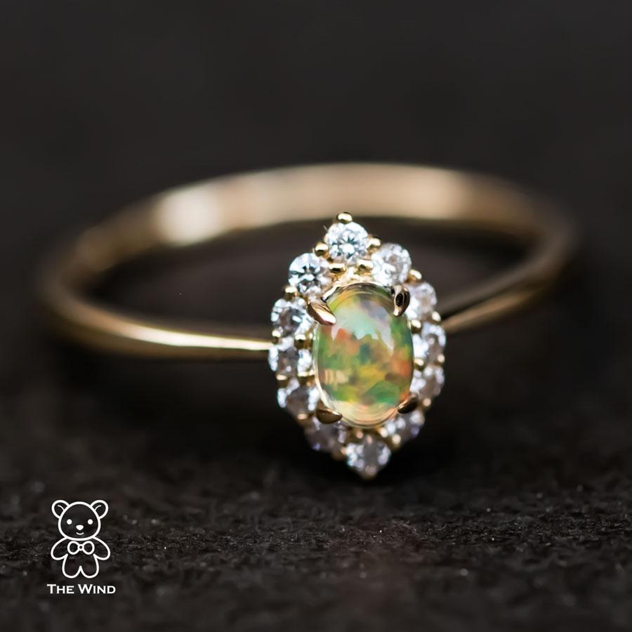 Minimalist Mexican Fire Opal Marquise Shaped Halo Diamond Engagement Ring 18K Yellow Gold.


Free Domestic USPS First Class Shipping! Free Gift Bag or Box with every order!

Opal—the queen of gemstones, is one of the most beautiful gemstones in the