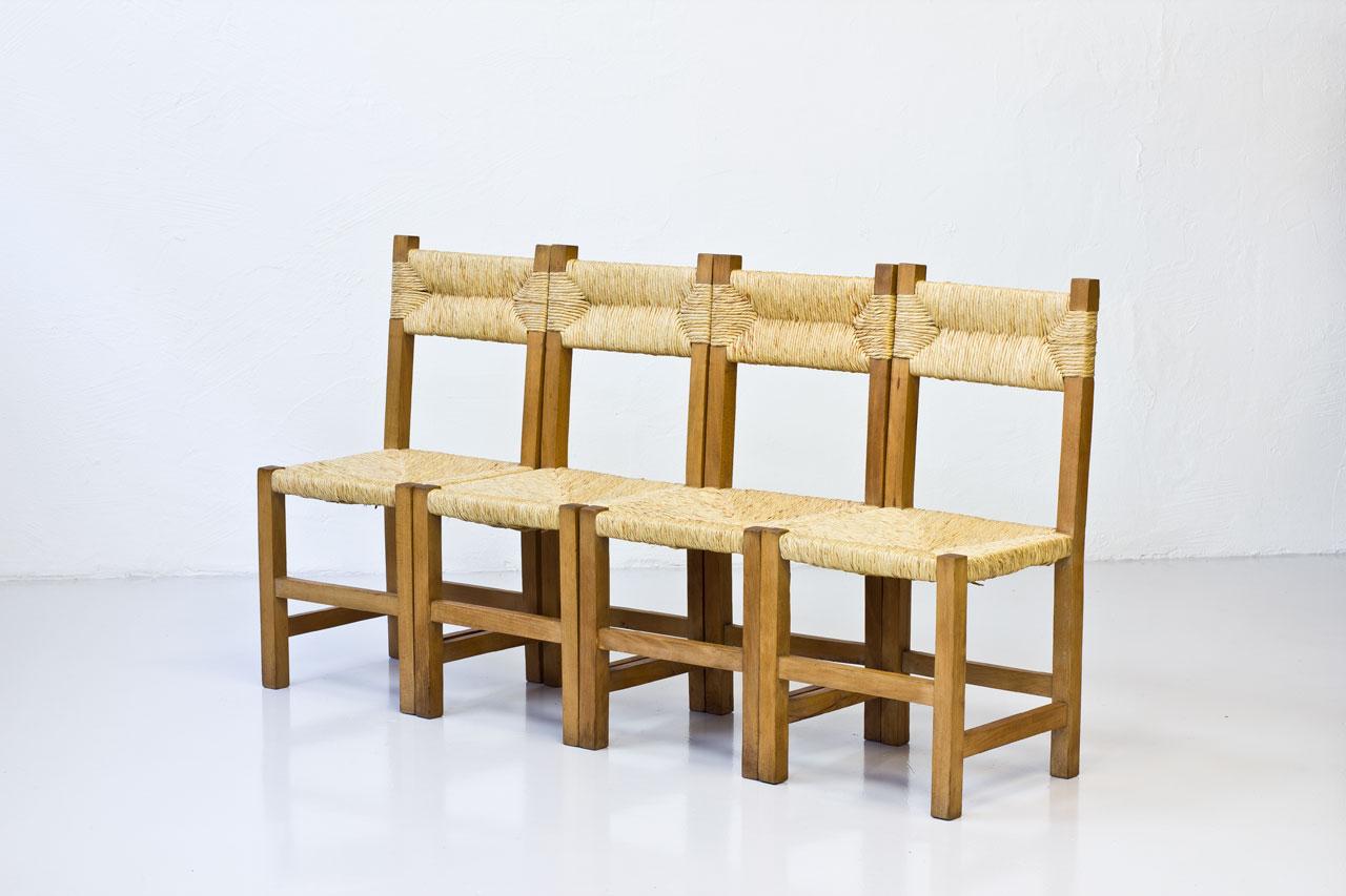 Set of four French rustic chairs, produced during the 1960s. Made from beech and straw.
Very good vintage condition with patina and signs of wear.