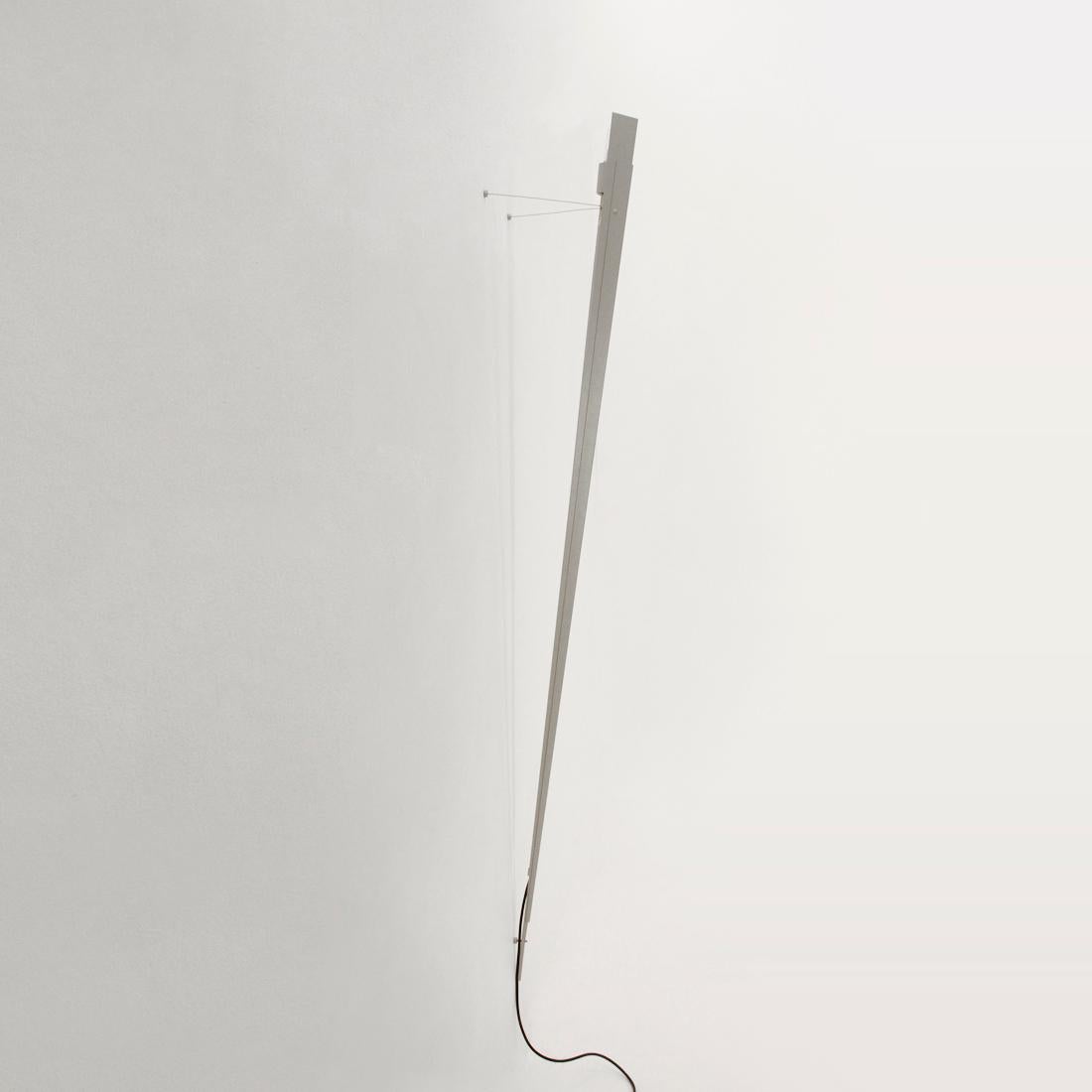 Wall lamp produced in the 1980s by Lumen Center designed by Gilles Derain.
Metal structure resting on the ground and holding up to the wall with two tie rods.
Good general conditions, some signs due to normal use over time.

Dimensions: Length