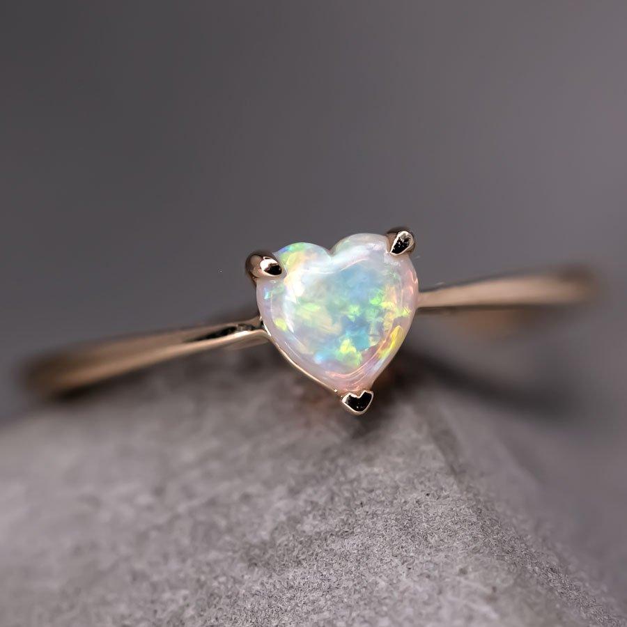 Minimalist Heart Shaped Australian Solid Opal Engagement Ring in 14K Yellow Gold.


Free Domestic USPS First Class Shipping! Free Gift Bag or Box with every order!

Opal—the queen of gemstones, is one of the most beautiful gemstones in the world.