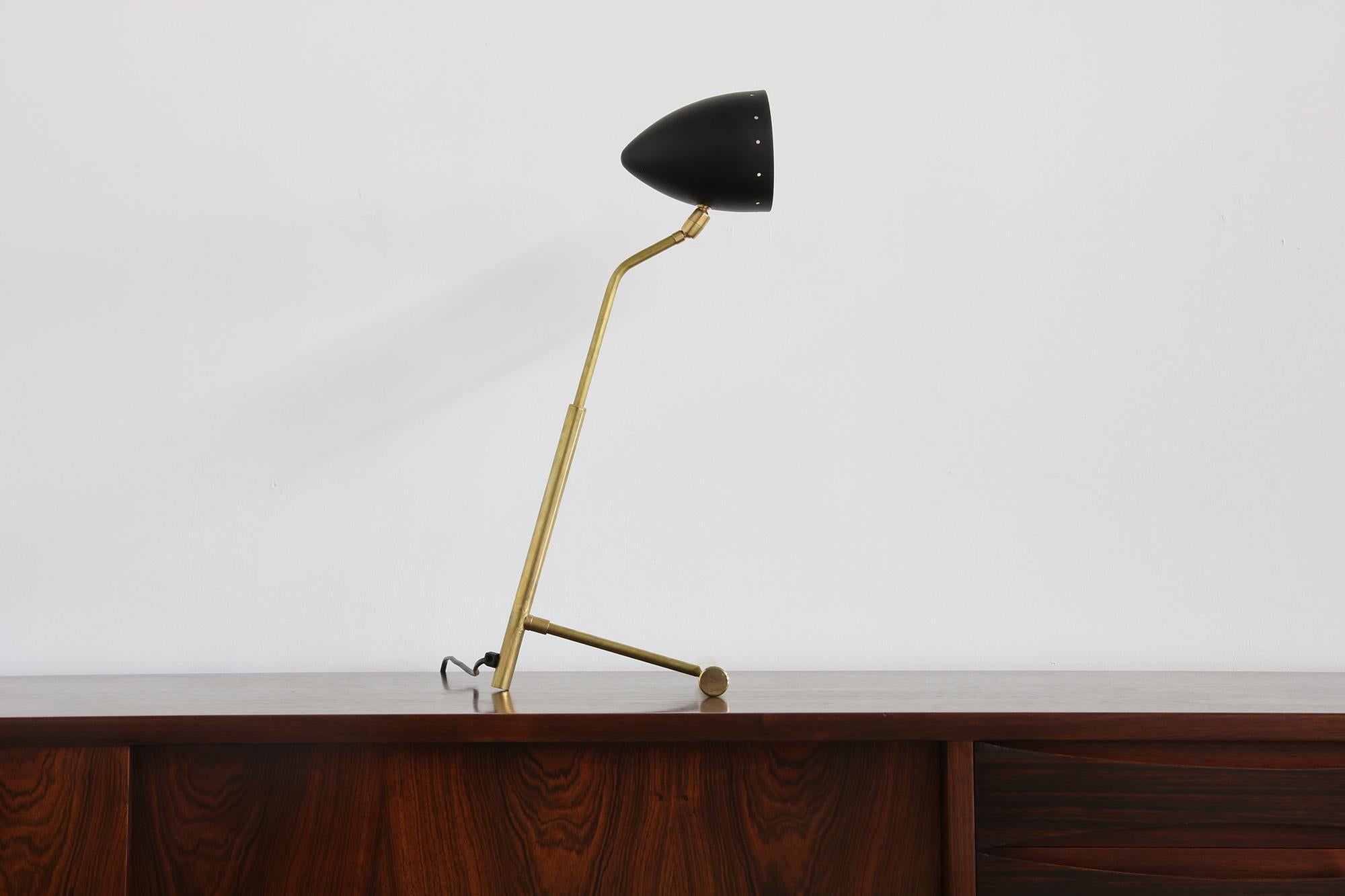 Beautiful Modern Italian table lamp in midcentury style.
Works in the US and Asia as well, of course in Europe also.
Adjustable lampshade, up to 60W
Several available
Also available with a white or red lampshade.
