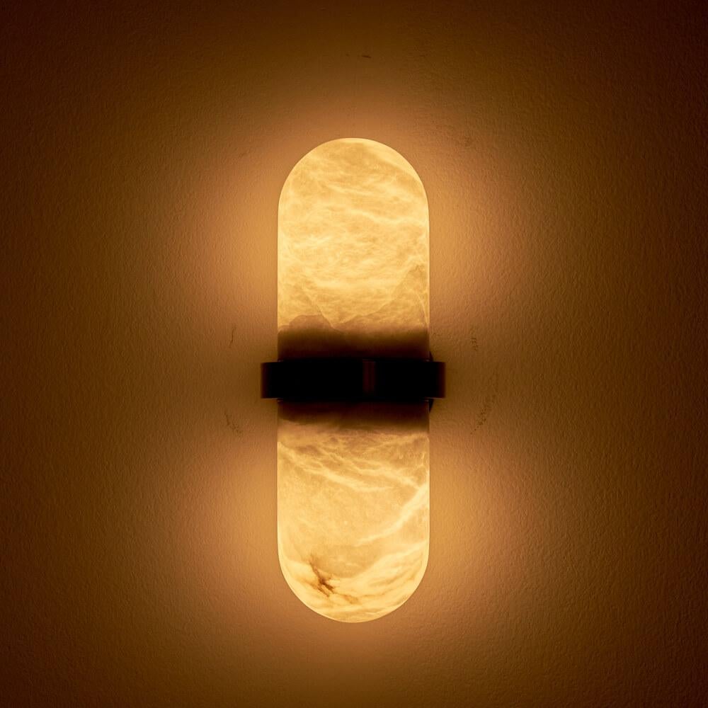 The PILL wall sconce has been conceived and developed in collaboration with the architecture firm Droulers Architecture.

The Pill wall sconce is a lighting fixture that has been designed with a simple and compact shape. It consists of two