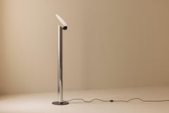 Minimalist Italian floor lamp from the late 1970s in chrome and brushed metal.