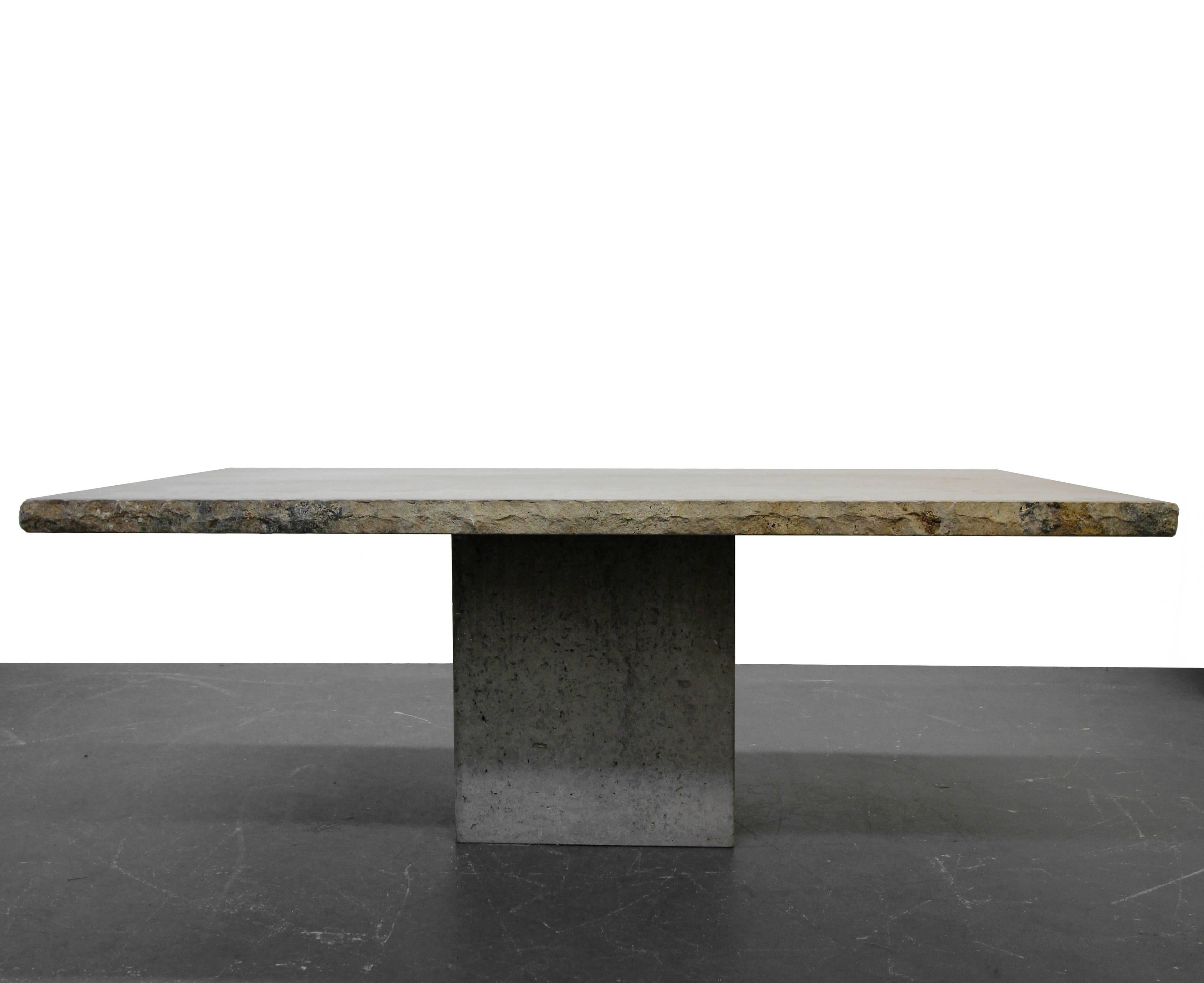 Nothing short of amazing. Solid travertine dining table straight from Italy. Has the appearance of polished concrete. A clear finish could be applied to bring out more of the color in the travertine, but we love the Industrial, raw appearance, of