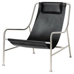 Chaise longue moderne et minimaliste en cuir noir et acier inoxydable poli