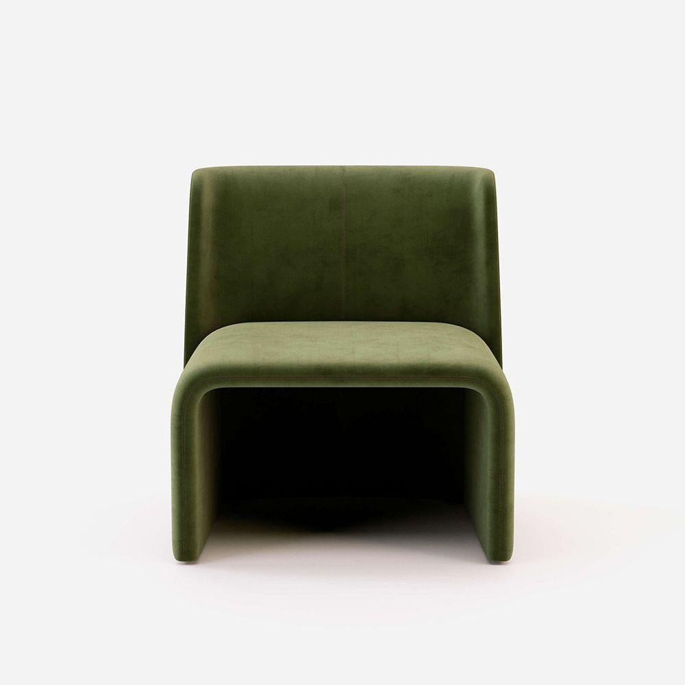 This stunning armchair is the result of highly innovative solutions attached to functional and cozy shapes, merging in a harmonious craftwork design. Without armrests, the wide back smoothly flows into the structure. On the back, a minimalistic line