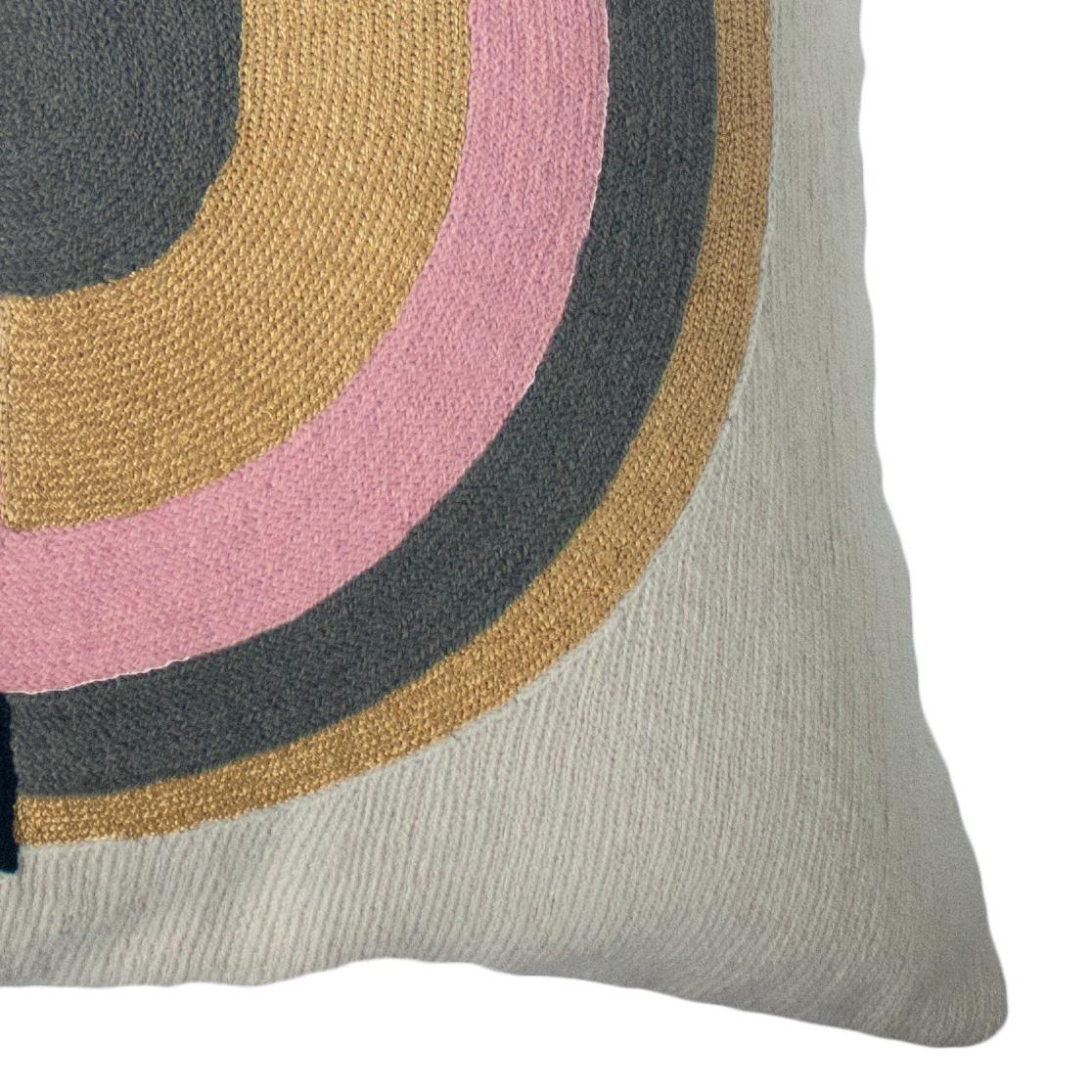 This geometric throw pillow has been ethically hand embroidered by artisans in Kashmir, India, using a traditional embroidery technique which is native to this region.

The purchase of this handcrafted pillow helps to support the artisans and