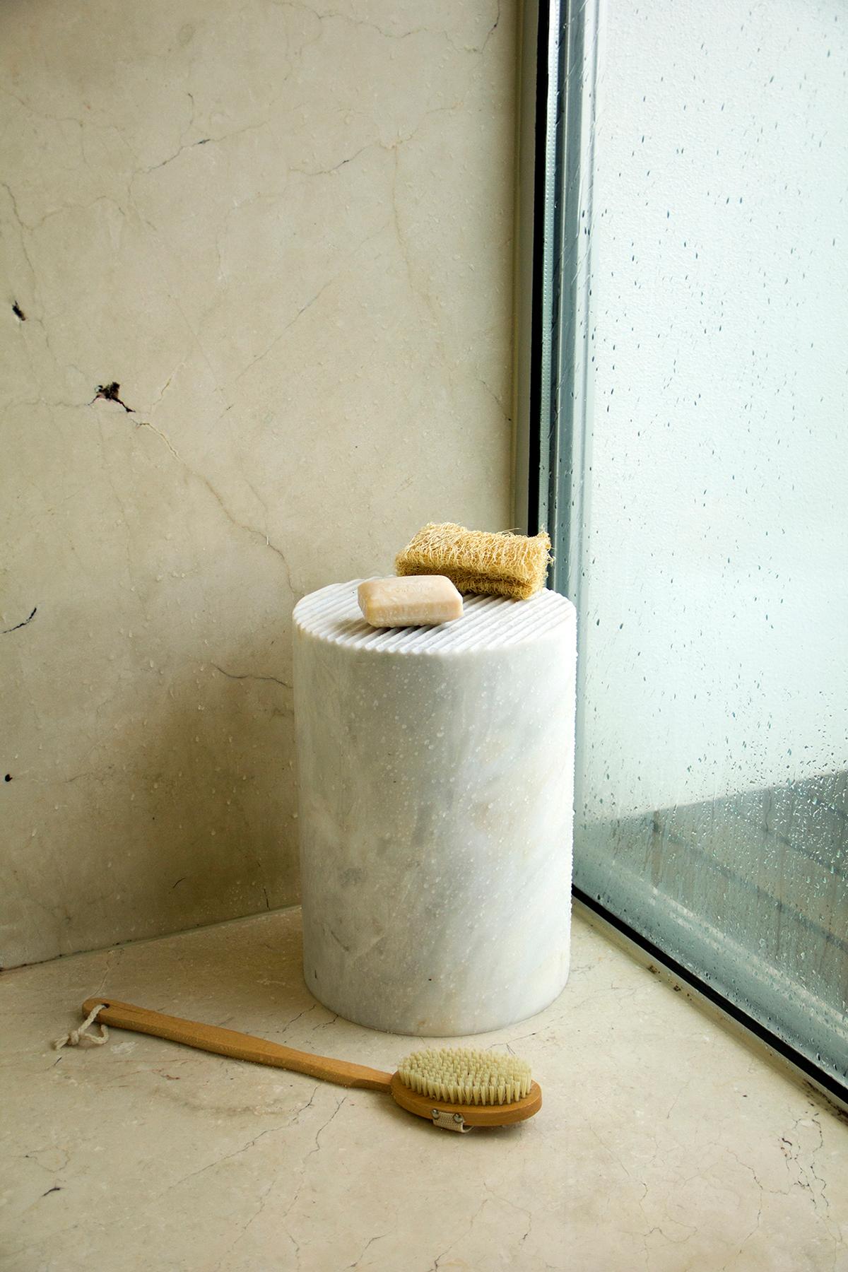 Carved from a single piece of stone, highlighting its beauty, and featuring a classic grooved pattern, this striking side table, created by Manuel Aires Mateus, conveys the elegance of Estremoz marble through a piece where the materiality is valued