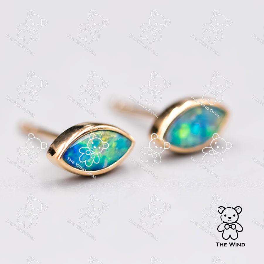 Minimalist Marquise Shaped Australian Doublet Opal Stud Earrings 18K Yellow Gold.

Free Domestic USPS First Class Shipping! Free Gift Bag or Box with every order!

Opal—the queen of gemstones, is one of the most beautiful gemstones in the world.