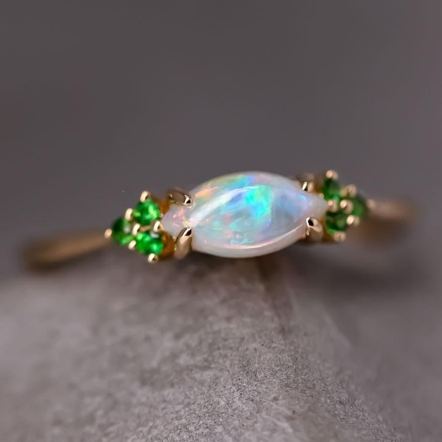 Minimalist Marquise Australian Solid Opal Tsavorite Engagement Ring 18K Yellow Gold.


Free Domestic USPS First Class Shipping! Free Gift Bag or Box with every order!

Opal—the queen of gemstones, is one of the most beautiful gemstones in the world.
