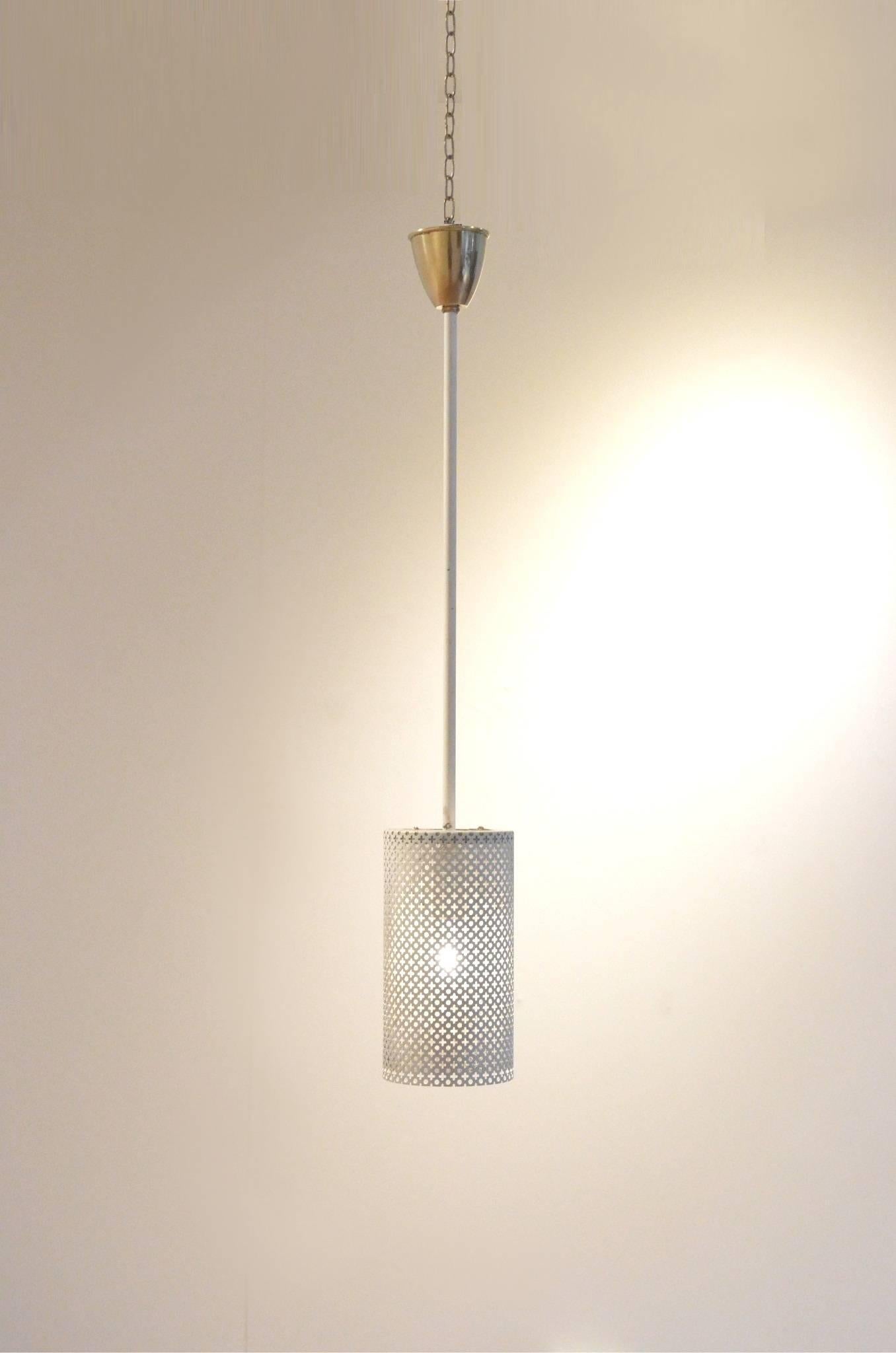 Minimalist pendant lamp from Pierre Guariche for Atelier Disderot, white perforated metal shade matched with brass accent.