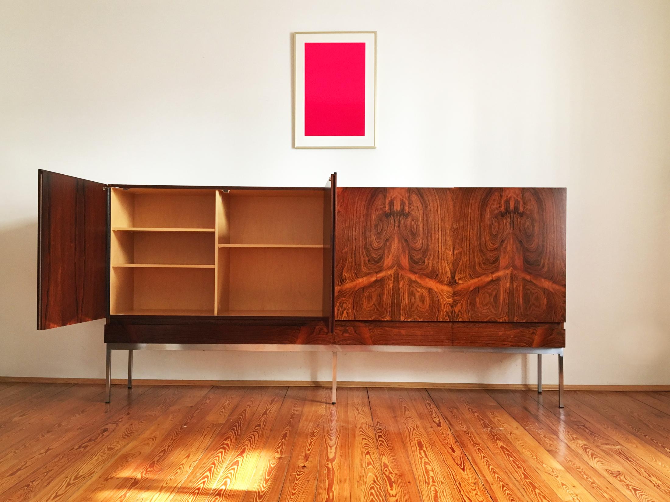 Rare Dieter Waeckerlin model B60 sideboard for Behr, Germany, 1950s.
Made of Rosewood veneer with dramatic grain and a chromed metal base. 
The inside is made of beech.