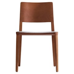 Minimalist modern Chair in natural solid wood upholstered textile seating