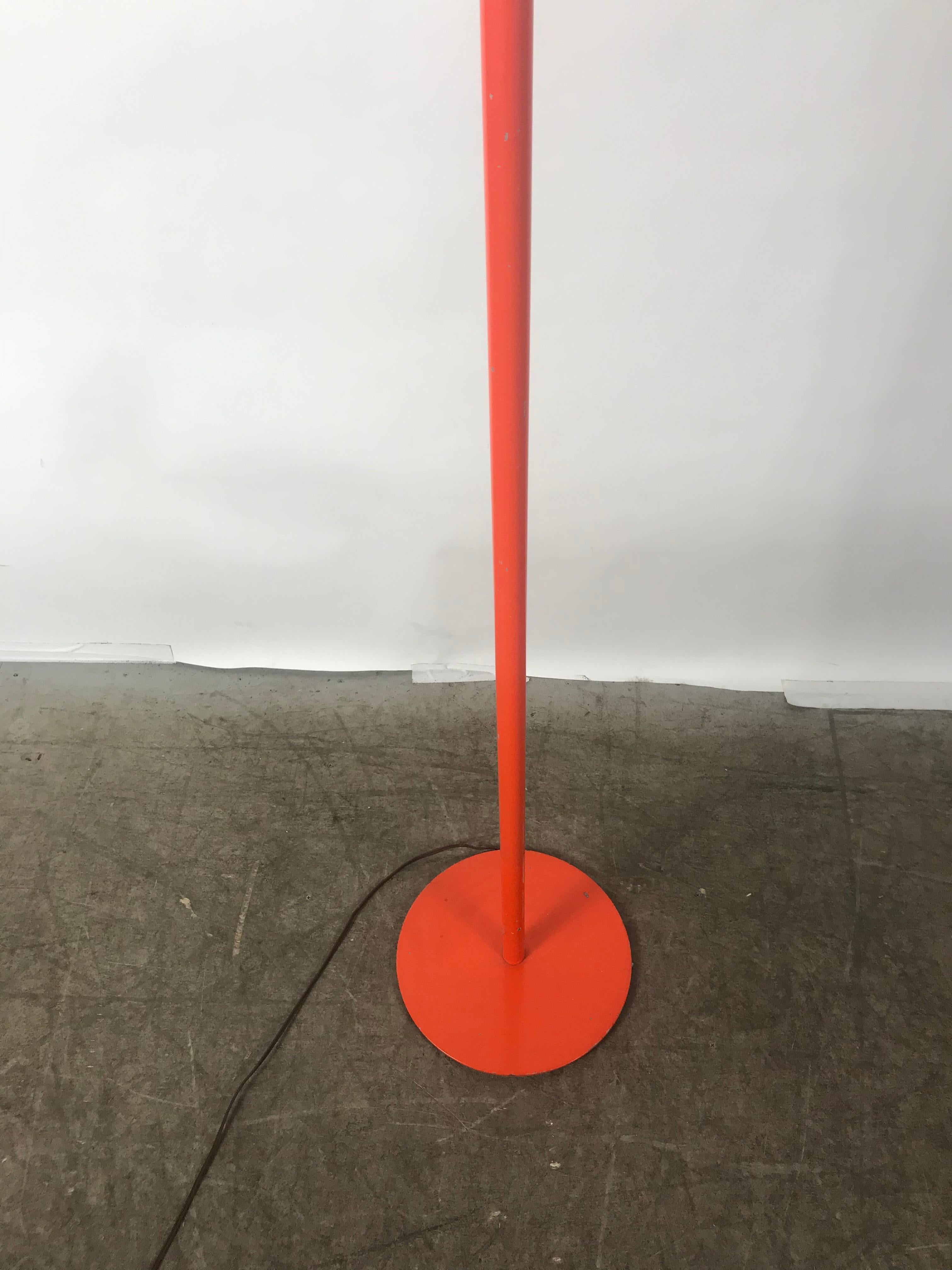 Simple elegant orange powder-coated torchiere lamp by Nessen Studio, circa 1970s.
  