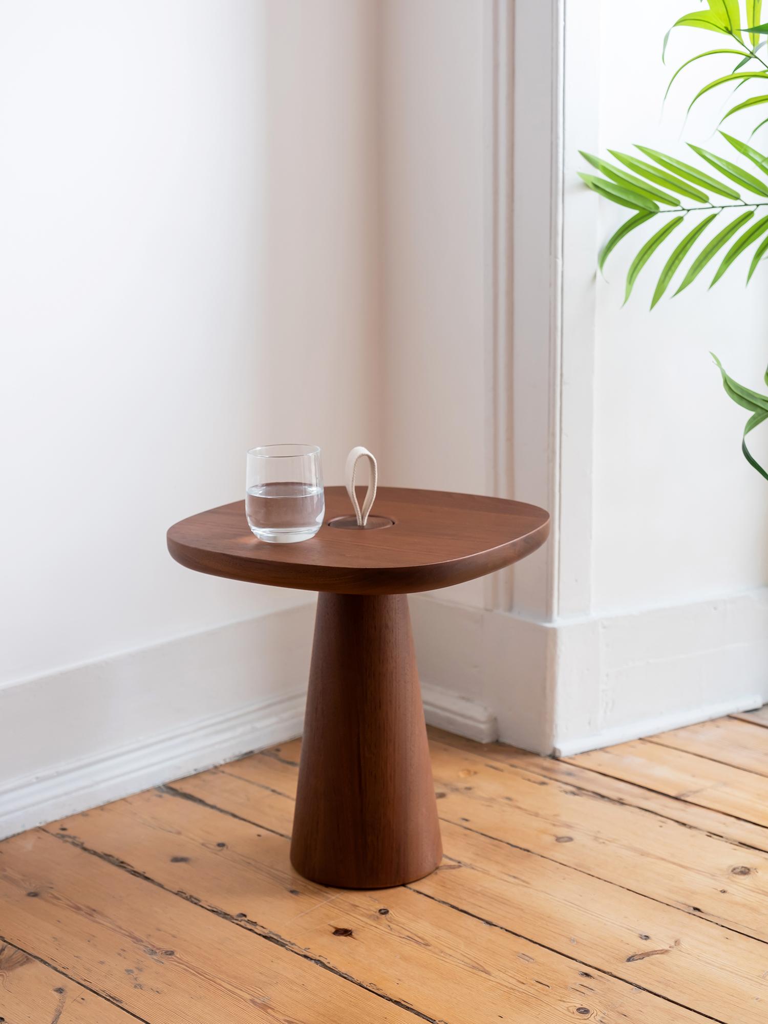 Minimal in its components, MIGO table consists of two parts: a table top, and a conical shaped base, whose top ends with a strap for it to be lifted by.

The soft and friendly shape of the top makes the table suitable for different situations, and