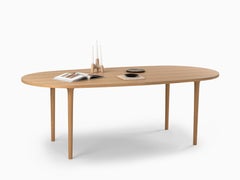 CAST – Minimalist Oval Dining Table in Walnut Wood