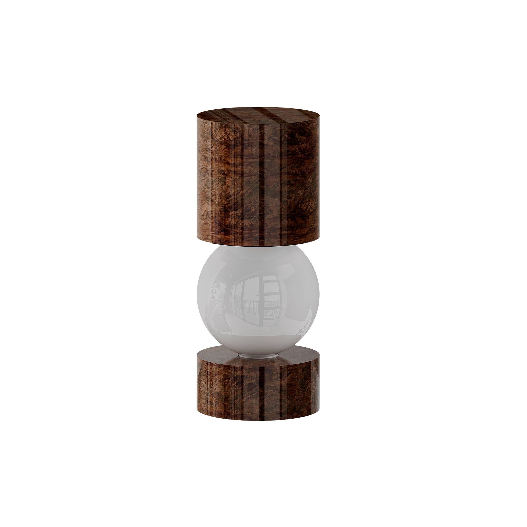 Mid-Century Modern Wood Table Lamp Rounded Shape Walnut Root Frosted Glass Light
The Orpheu Table Lamp Wood is a symphony of balance and light featuring a sleek cylindrical wood structure that frames a floating light source. Crafted with a wood