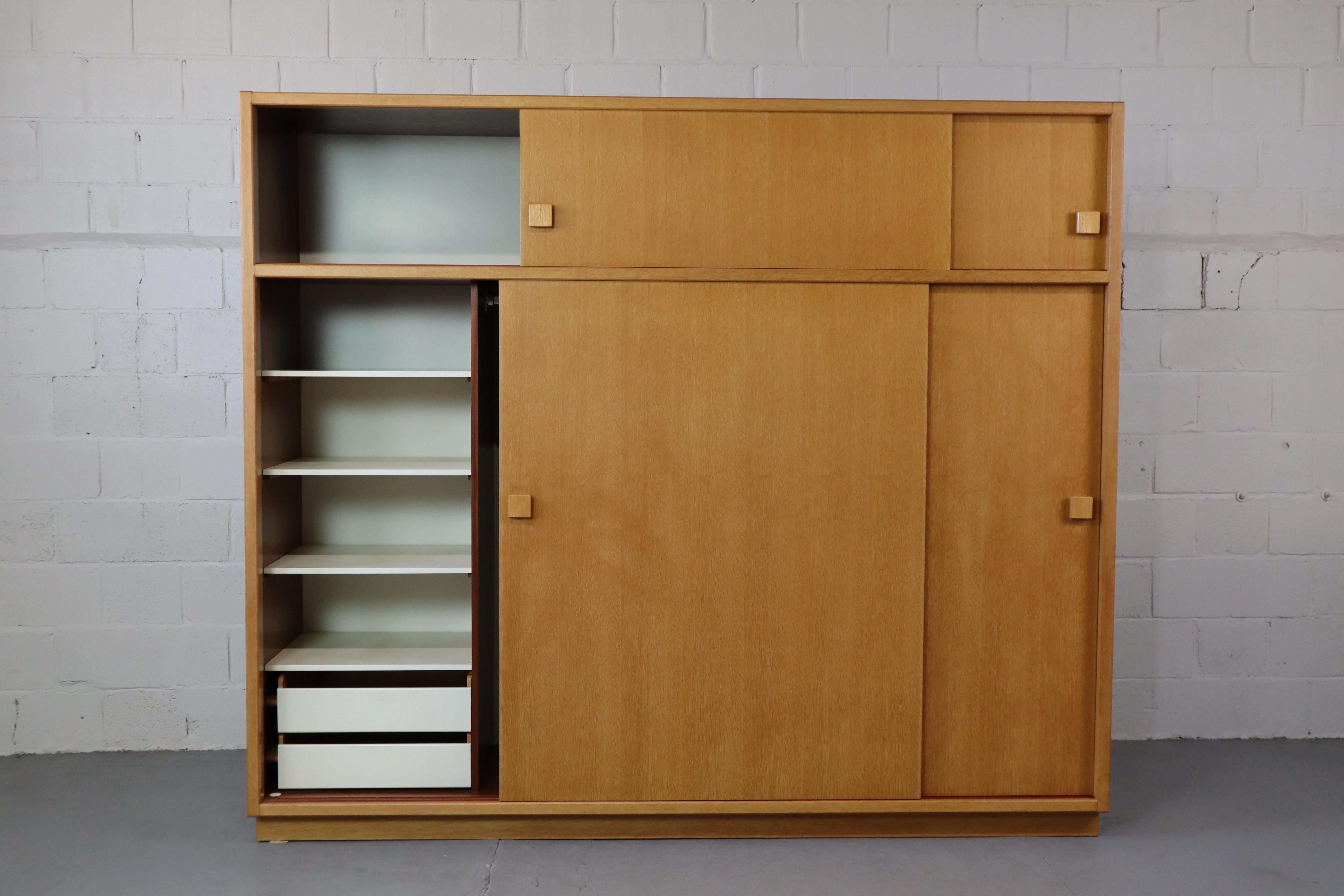 Large minimalist wardrobe by Bob Van den Berghe for Van den Berghe-Pauvers, 1969
The wardrobe has 4 sliding doors, 2 drawers, clothes hanging area and various shelves.
The cabinet is very high-quality in solid oak and oak veneer.
The cabinet can