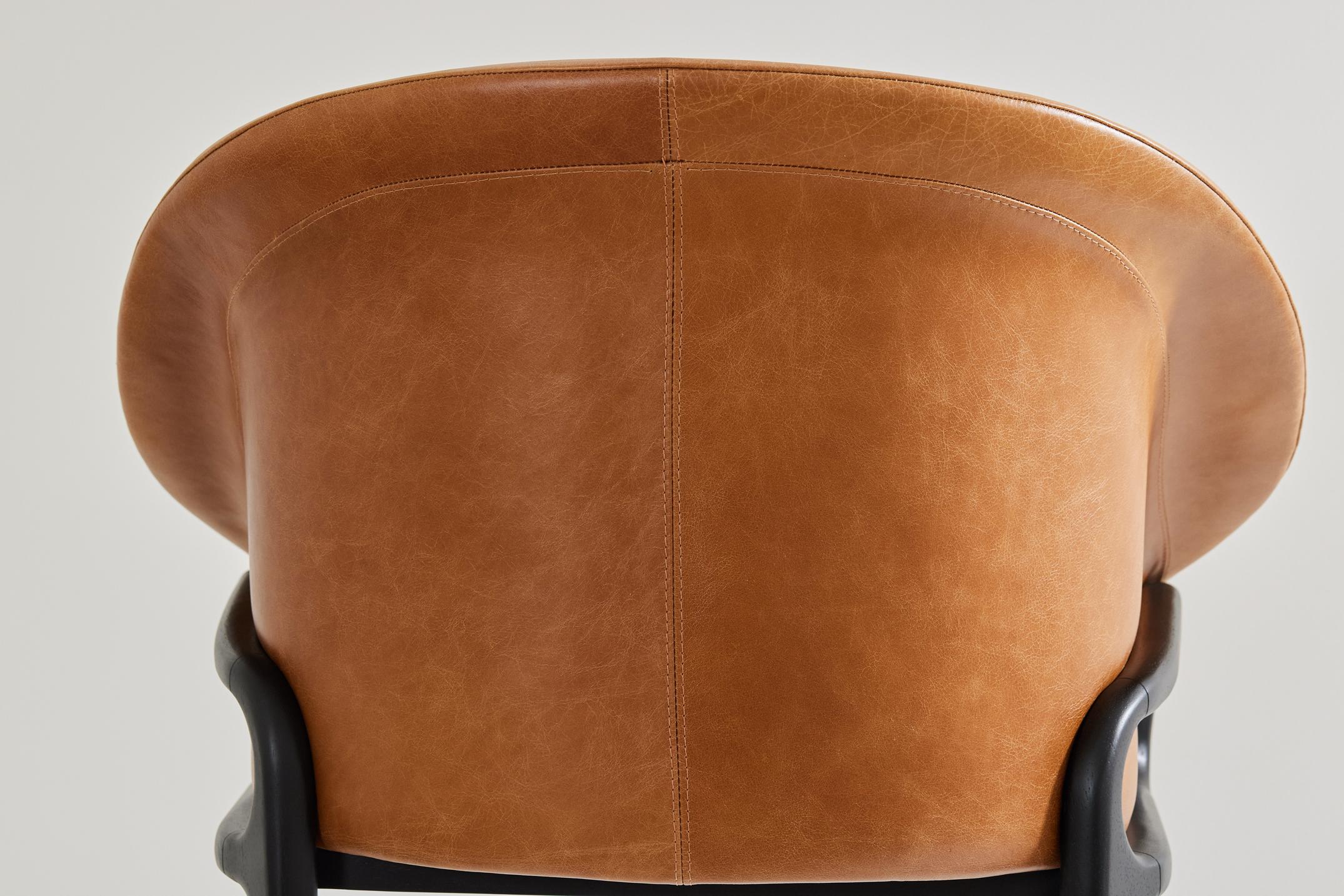 Leather Minimalist Organic Chair in black Solid Wood, camel leather Seating tone For Sale