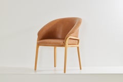 Minimalist Organic Chair in Solid Wood, camel leather Seating tone