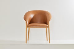 Minimalist Organic Chair in Solid Wood, camel leather Seating tone