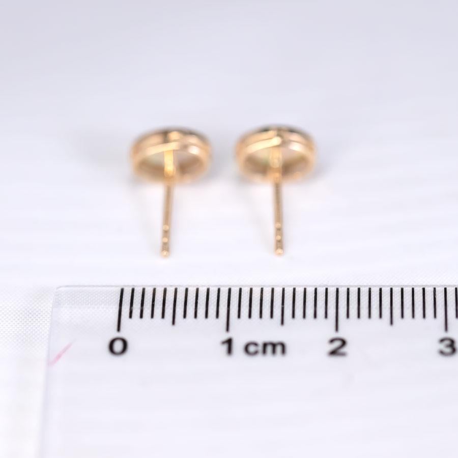 Oval Cut Minimalist Oval Australian Solid Opal Stud Earrings 14k Yellow Gold For Sale