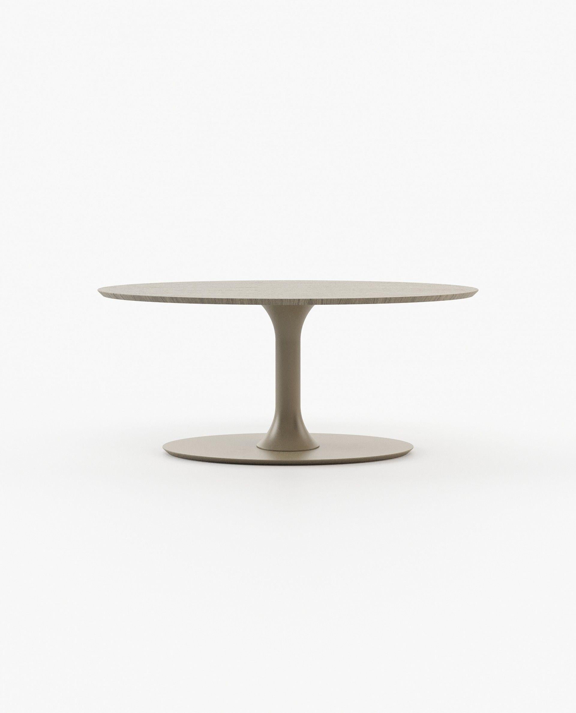Crafted with an air of opulence and innovation, the dining table stands as a testament to exquisite design tailored for discerning dining spaces. Its oval-shaped top, supported by a sturdy column, harmoniously merges functionality with aesthetic