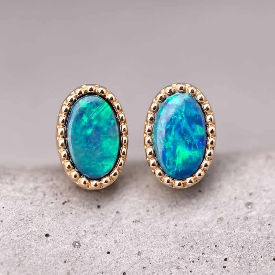 Minimalist Oval Australian Doublet Opal Stud Earrings 18K Yellow Gold.


Free Domestic USPS First Class Shipping!  Free One Year Limited Warranty!  Free Gift Bag or Box with every order!



Opal—the queen of gemstones, is one of the most beautiful