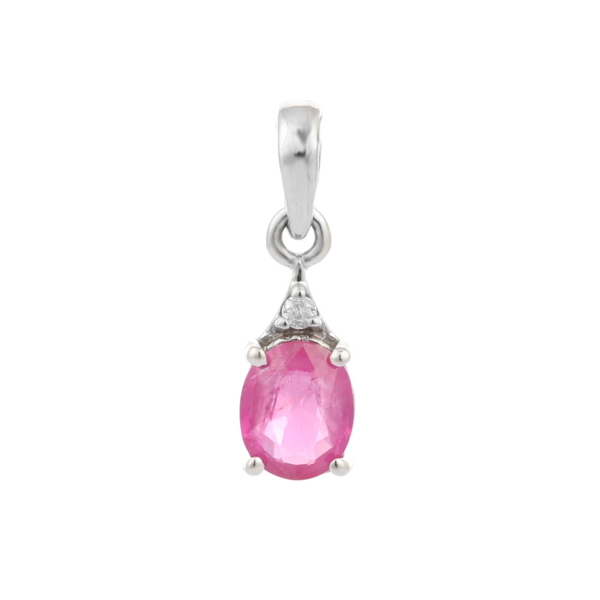 Ruby Pendant with Diamond in 14K Gold. It has a oval cut ruby with diamond that completes your look with a decent touch. Pendants are used to wear or gifted to represent love and promises. It's an attractive jewelry piece that goes with every basic